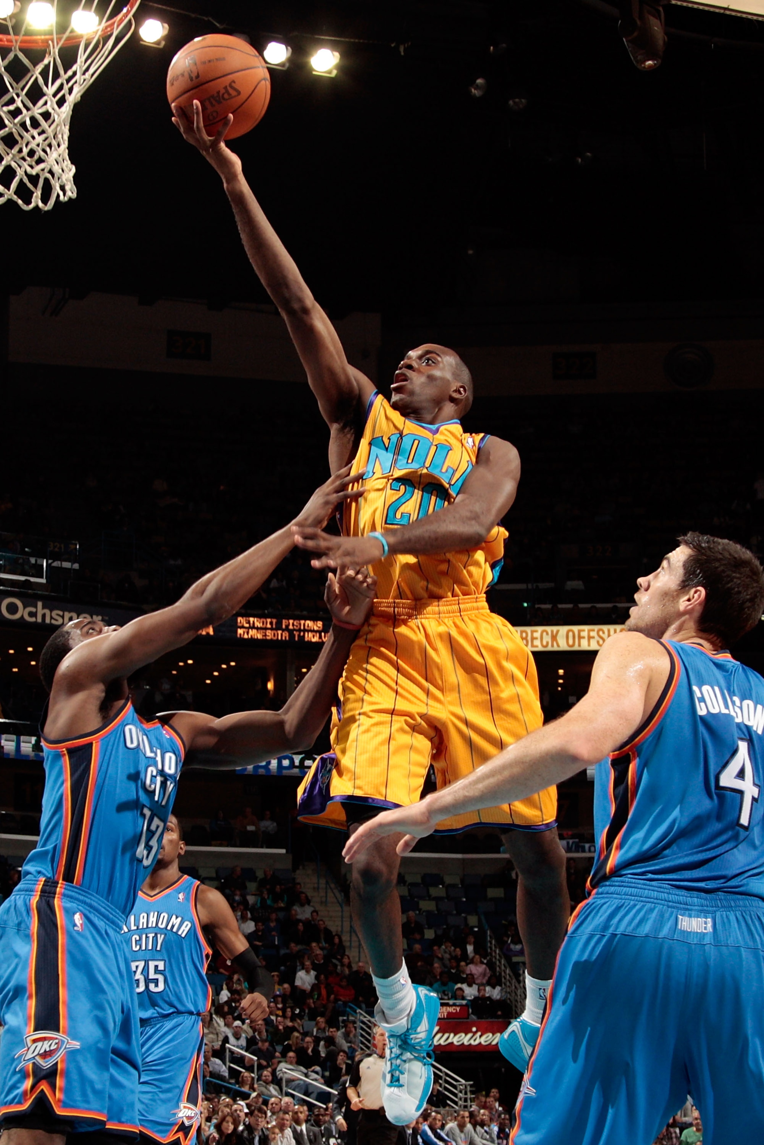 NEW ORLEANS, LA - DECEMBER 10:  Quincy Pondexter #20 of the New Orleans Hornets shoots the ball over James Harden #13 and Nick Collison #4 of the Oklahoma City Thunder at New Orleans Arena on December 10, 2010 in New Orleans, Louisiana.    NOTE TO USER: U