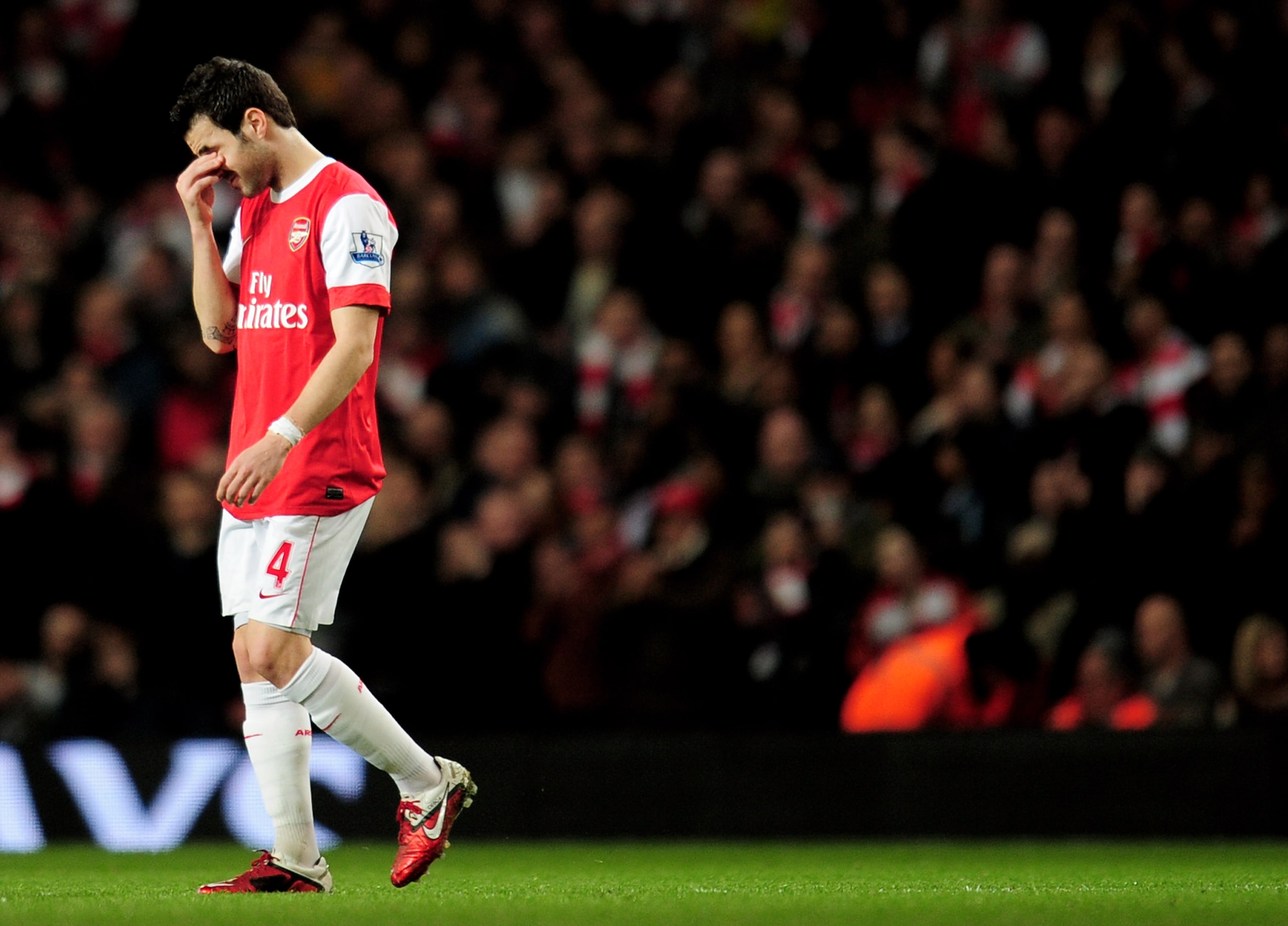 LONDON, ENGLAND - FEBRUARY 23:  Cesc Fabregas of Arsenal looks dejected as he leaves the pitch injured during the Barclays Premier League match between Arsenal and Stoke City at the Emirates Stadium on February 23, 2011 in London, England.  (Photo by Shau