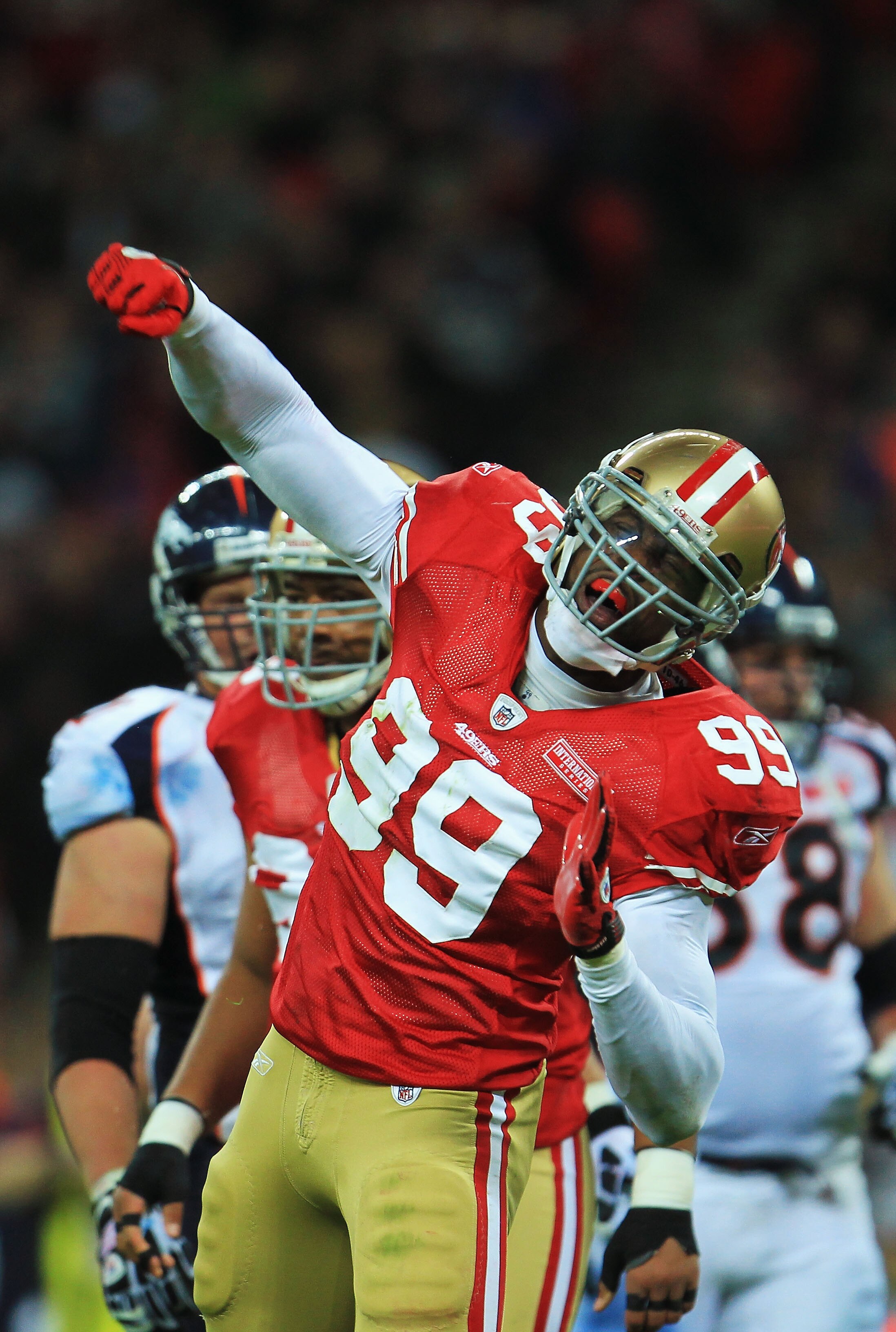 LONDON, ENGLAND - OCTOBER 31:  Manny Lawson #99 of San Francisco 49ers celebrates as he sacks Kyle Orton #8 of Denver Broncos during the NFL International Series match between Denver Broncos and San Francisco 49ers at Wembley Stadium on October 31, 2010 i