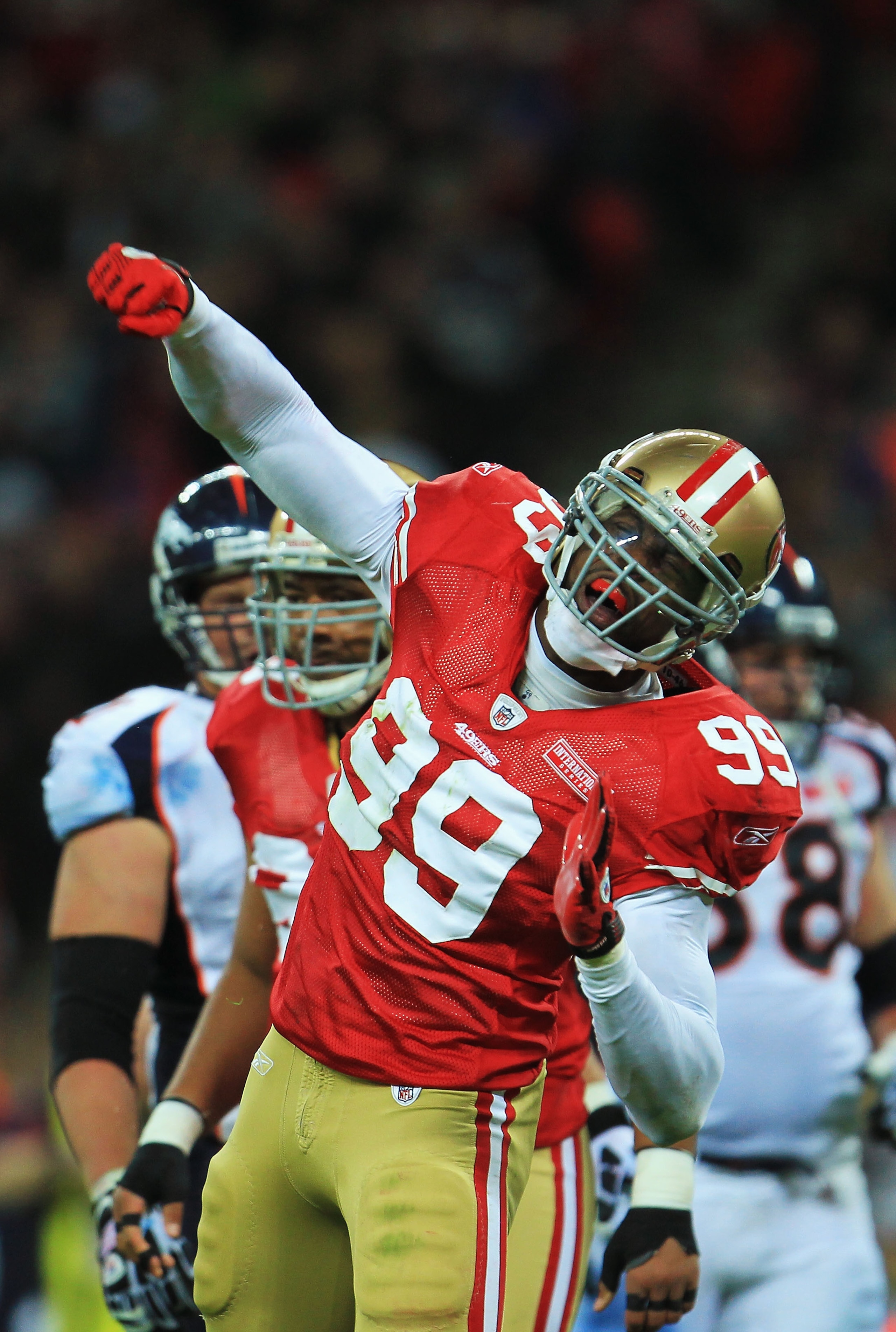 LONDON, ENGLAND - OCTOBER 31:  Manny Lawson #99 of San Francisco 49ers celebrates as he sacks Kyle Orton #8 of Denver Broncos during the NFL International Series match between Denver Broncos and San Francisco 49ers at Wembley Stadium on October 31, 2010 i