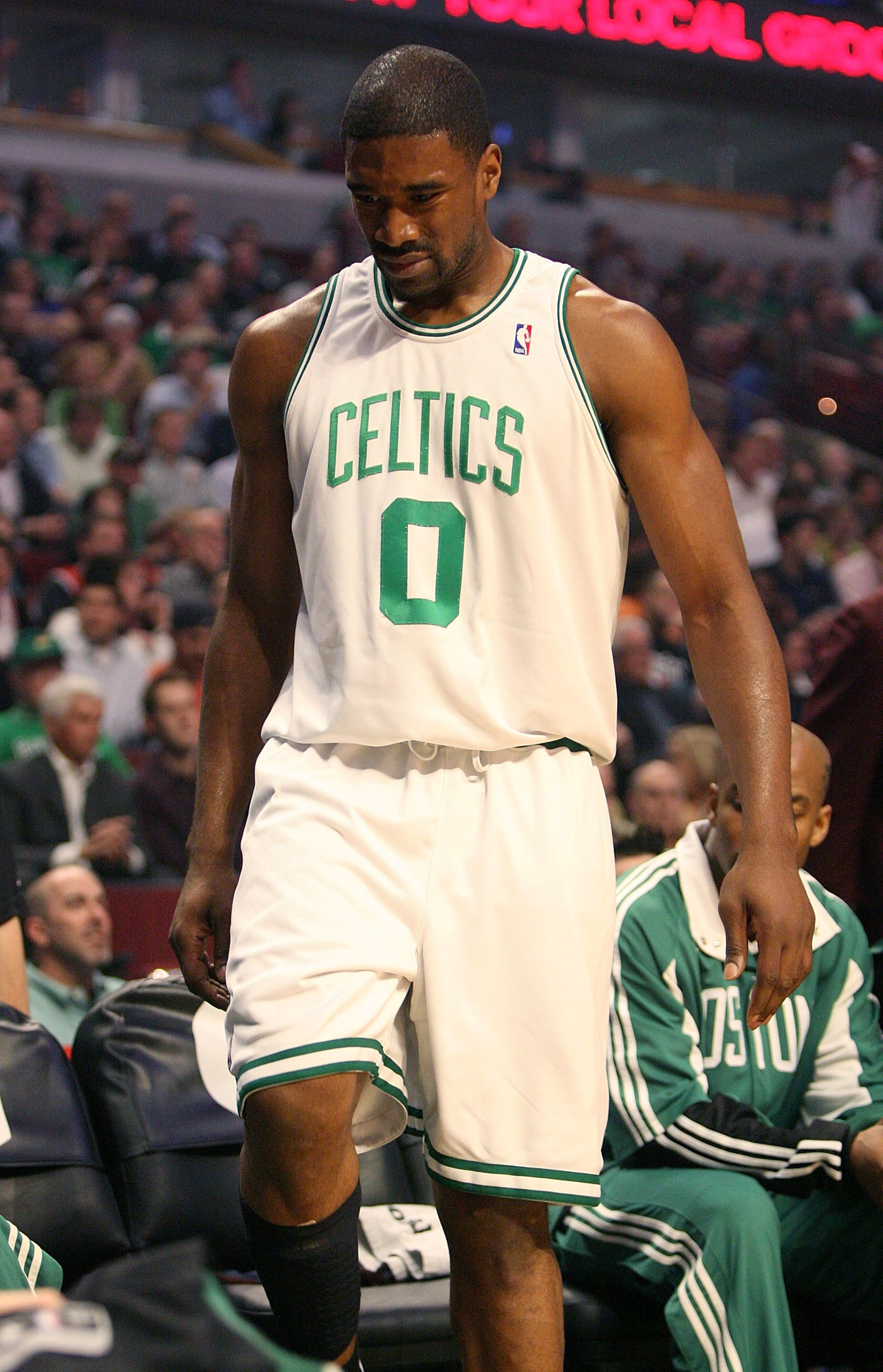 CHICAGO - MARCH 17: Leon Powe #0 of the Boston Celtics tests out an injured knee near the bench during a game against the Chicago Bulls on March 17, 2009 at the United Center in Chicago, Illinois. NOTE TO USER: User expressly acknowledges and agreees that
