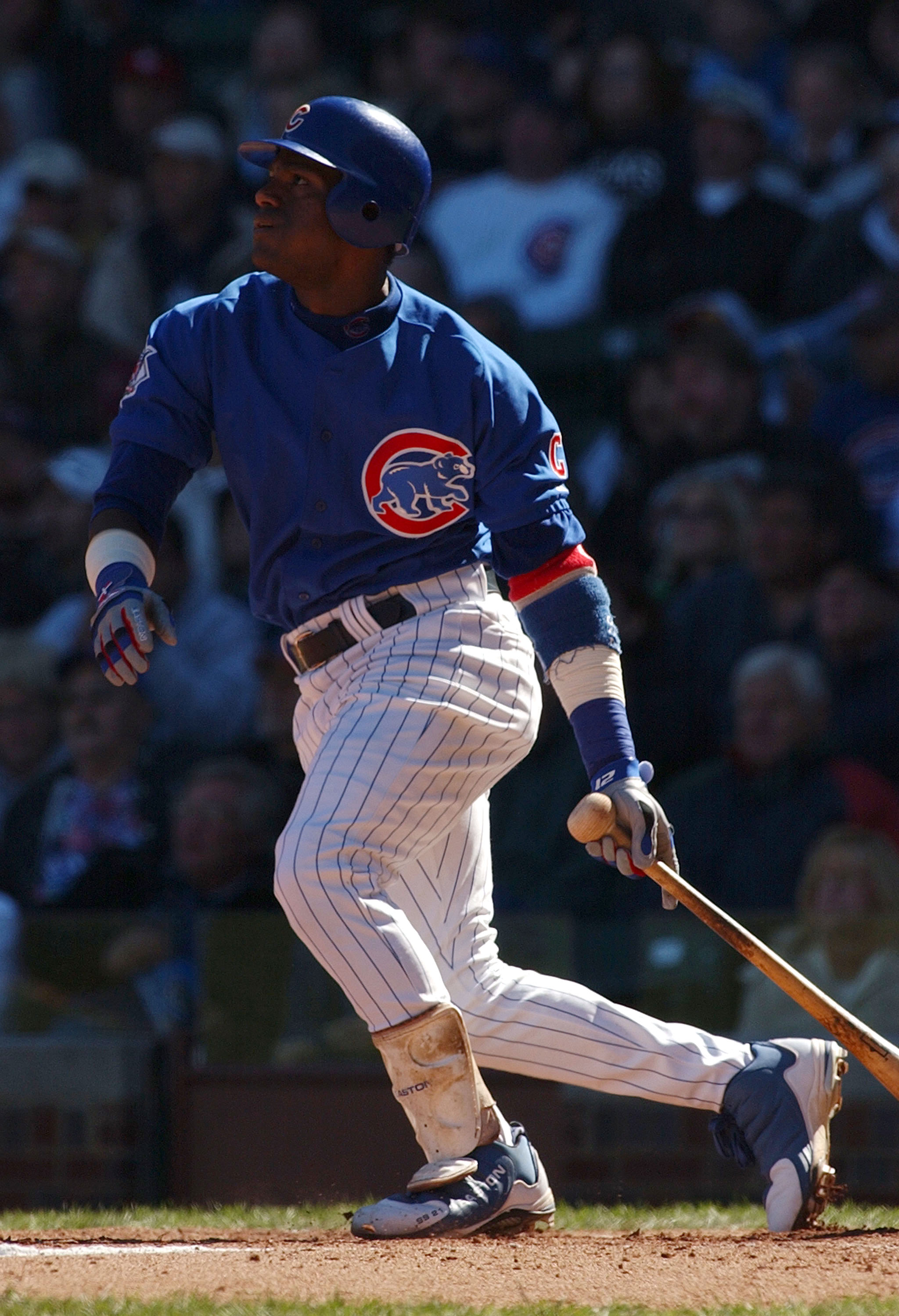 CHICAGO - OCTOBER 2:  Sammy Sosa #21 of the Chicago Cubs hits his 35th home run of the year and the 574th of his career putting him in sole possession of 7th place on the MLB all-time home run list during a game against the Atlanta Braves on October 2, 20