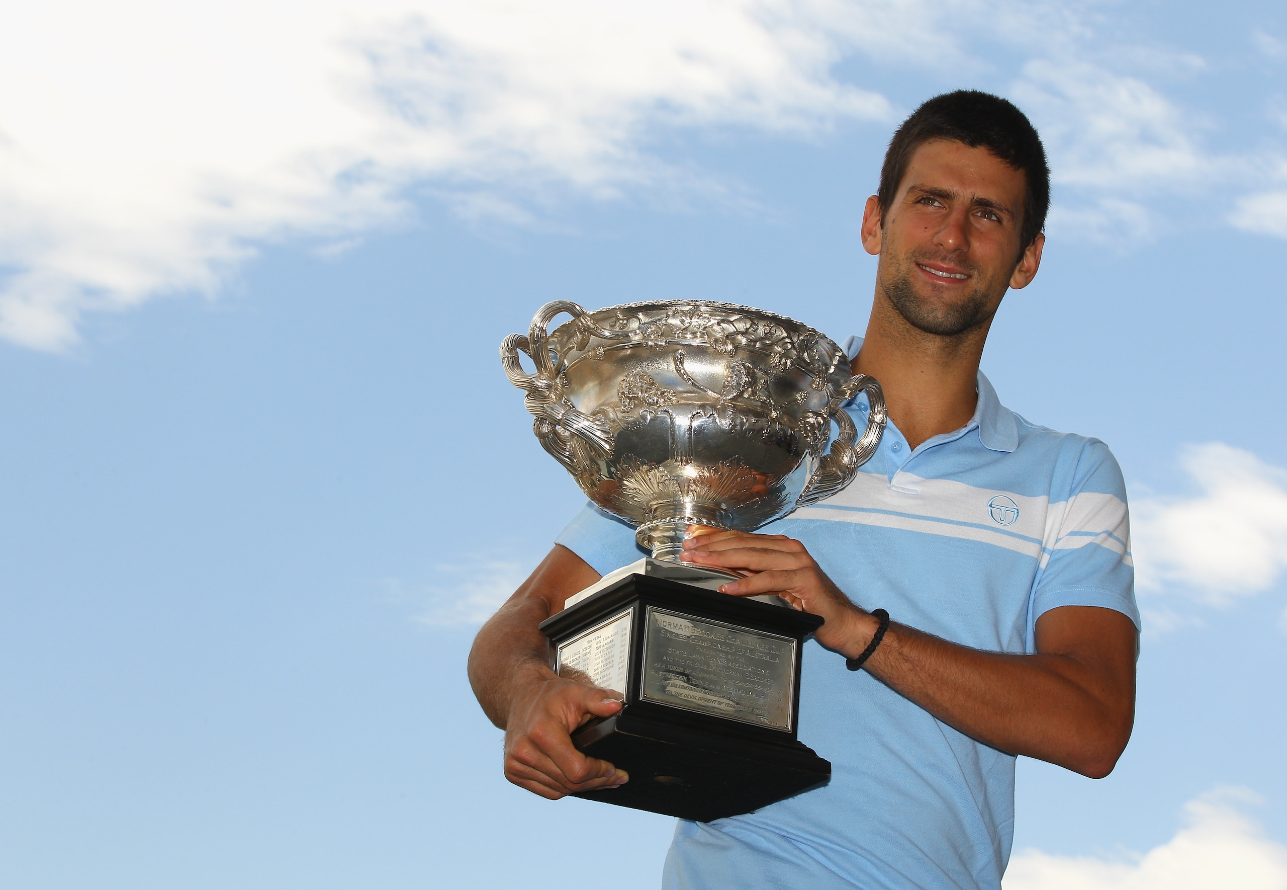 MELBOURNE, AUSTRALIA - JANUARY 31:  Novak Djokovic of Serbia poses with the Norman Brookes Challenge Cup at the Melbourne Cricket Ground on January 31, 2011 in Melbourne, Australia.  (Photo by Mark Dadswell/Getty Images)