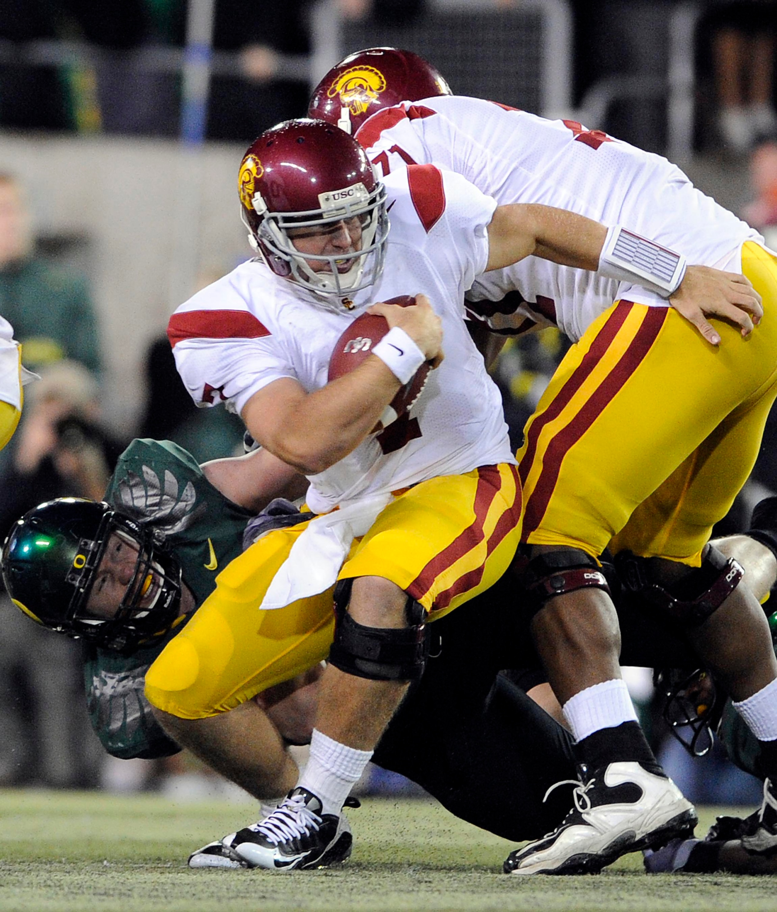 EUGENE, OR - OCTOBER 31: Quarterback Matt Barkley #7 of the USC Trojans is sacked in the third quarter of the game against the Oregon Ducks at Autzen Stadium on October 31, 2009 in Eugene, Oregon. The Ducks upset the Trojans 47-20. (Photo by Steve Dykes/G