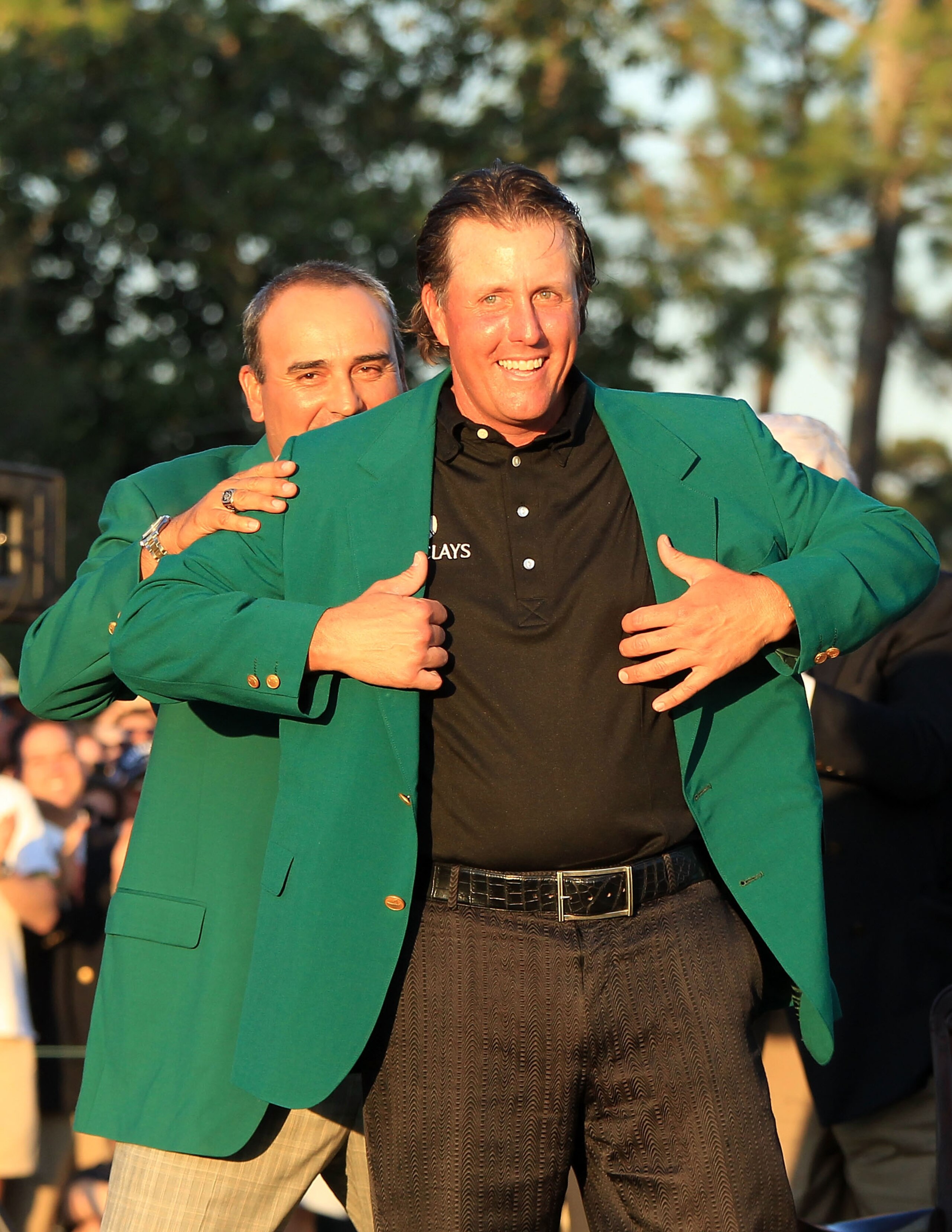 AUGUSTA, GA - APRIL 11:  (L-R) Angel Cabrera of Argentina presents Phil Mickelson with the green jacket during the green jacket presentation after the final round of the 2010 Masters Tournament at Augusta National Golf Club on April 11, 2010 in Augusta, G