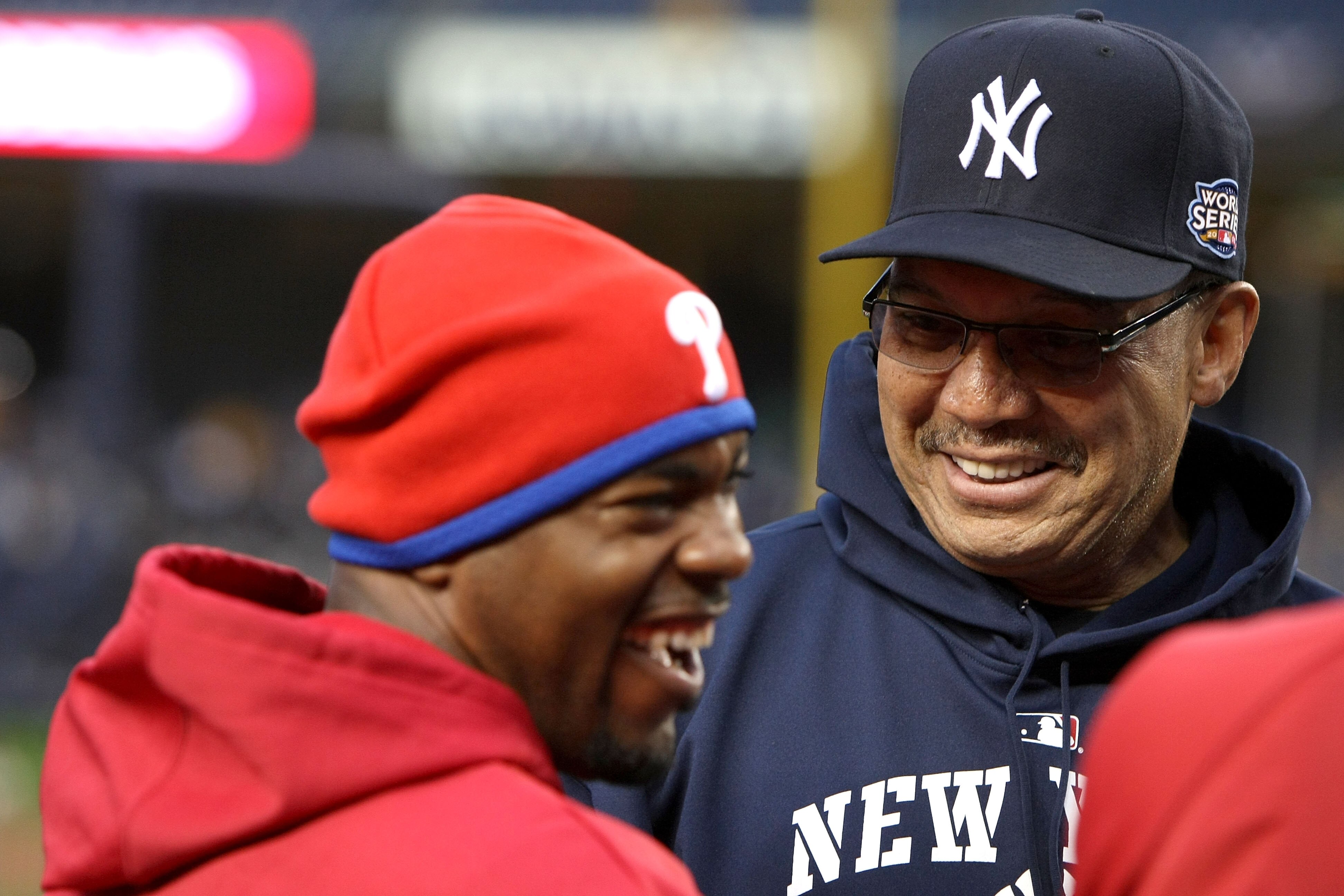 NEW YORK - OCTOBER 28:  Former NY Yankee and Baseball Hall of Famer Reggie Jackson (R) talks with Jimmy Rollins #11 of the Philadelphia Phillies during batting practice against the New York Yankees in Game One of the 2009 MLB World Series at Yankee Stadiu