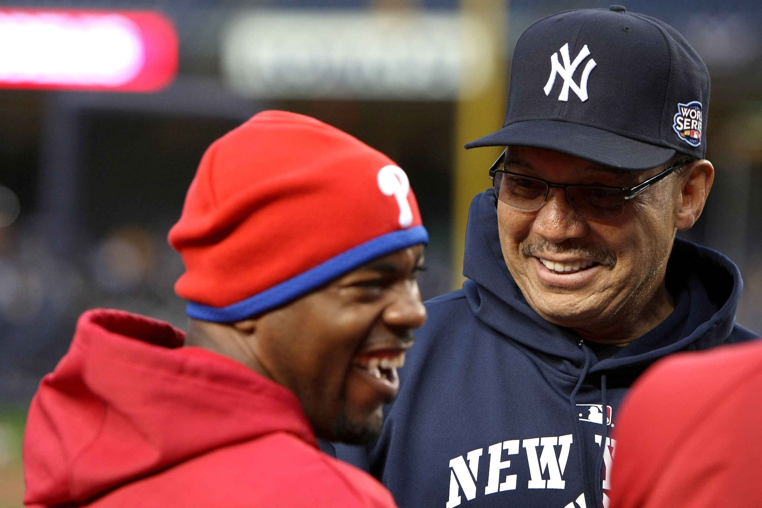 NEW YORK - OCTOBER 28:  Former NY Yankee and Baseball Hall of Famer Reggie Jackson (R) talks with Jimmy Rollins #11 of the Philadelphia Phillies during batting practice against the New York Yankees in Game One of the 2009 MLB World Series at Yankee Stadiu