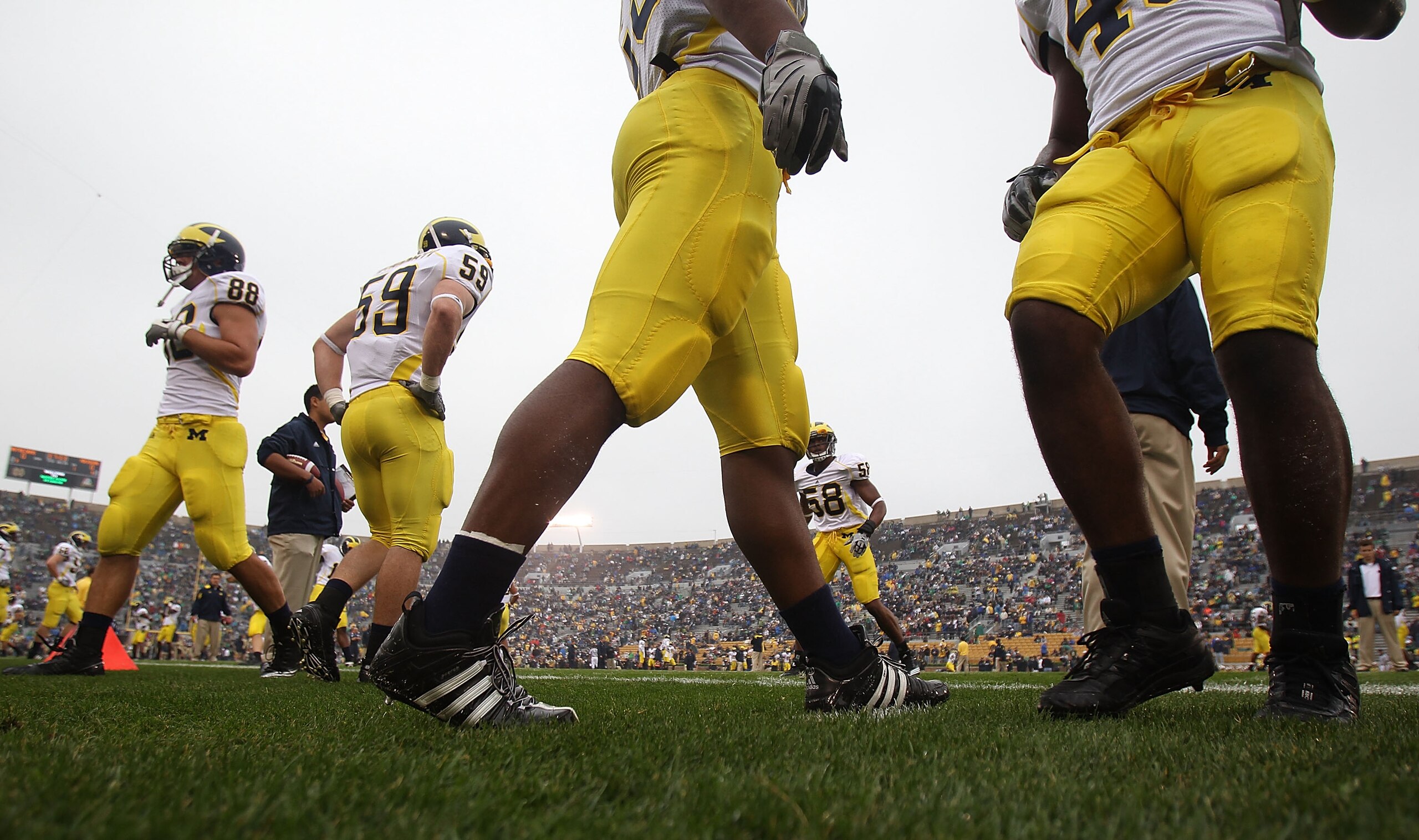 SOUTH BEND, IN - SEPTEMBER 11: Members of the Michigan Wolverine defense including Craig Roh #88 and Paul Gyarmati #59 participate in warm-ups beofre a game against the Notre Dame Fighting Irish  at Notre Dame Stadium on September 11, 2010 in South Bend,
