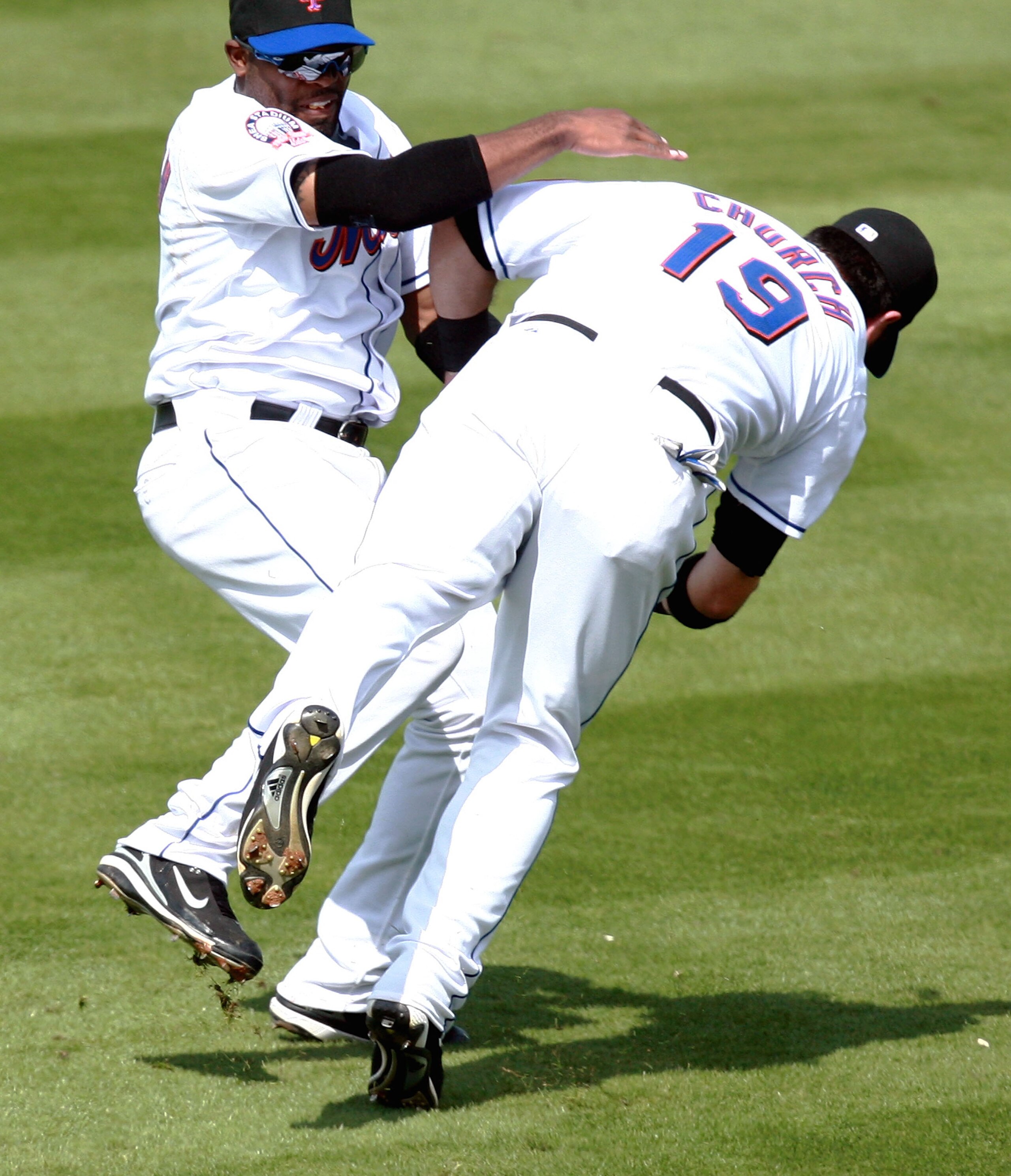PORT SAINT LUCIE, FL - MARCH 01:  Right fielder Ryan Church #19 and first baseman Marlon Anderson #9 of the New York Mets collide in shallow right field while both where chasing a fly ball against the Los Angeles Dodgers in a Spring Training game at Tradi
