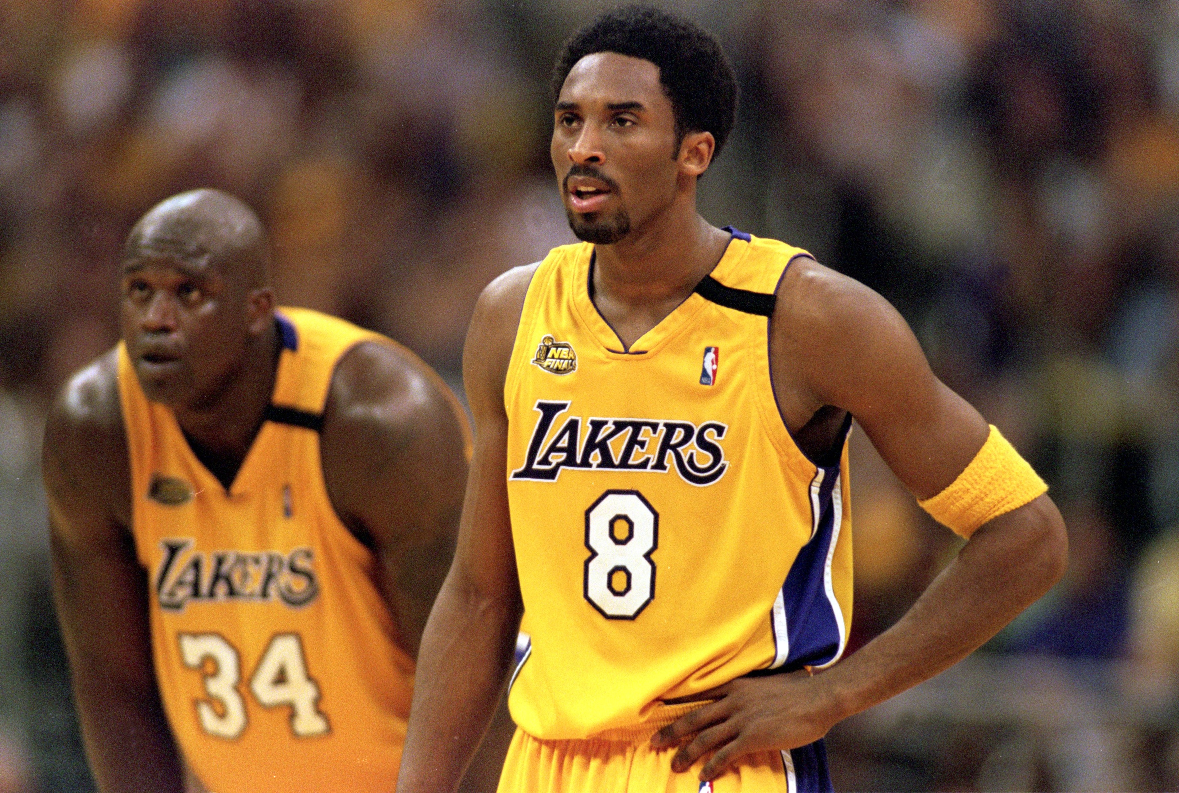 19 Jun 2000:  Kobe Bryant #8 and Shaquille O''Neal #34 of the Los Angeles Lakers looking on during the NBA Finals Game 6 against the Indiana Pacers at the Staples Center in Los Angeles, California.  The Lakers defeated the Pacers in 116-111.  NOTE TO USER