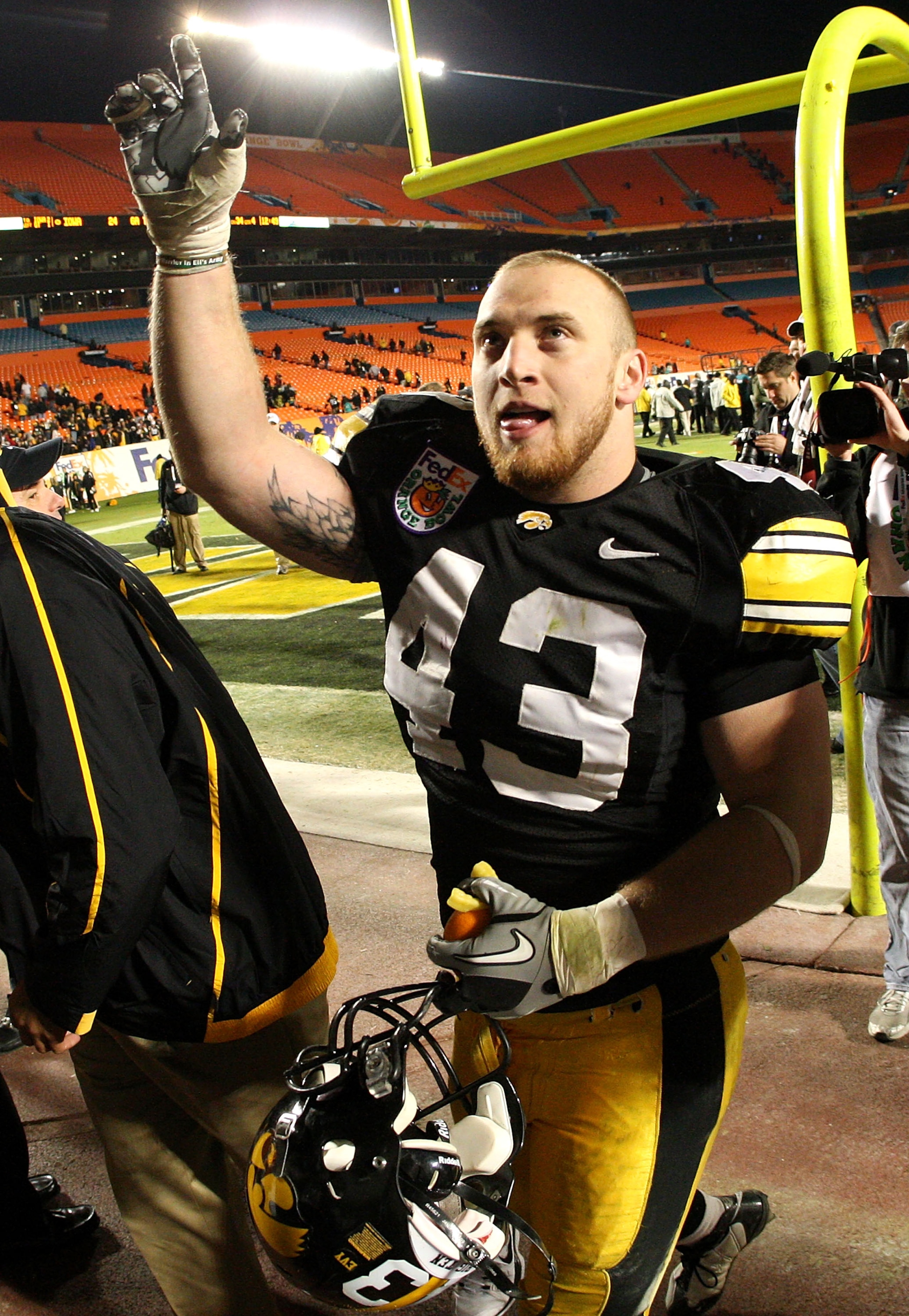 MIAMI GARDENS, FL - JANUARY 05:  Pat Angerer #43 of the Iowa Hawkeyes celebrate against the Georgia Tech Yellow Jackets during the FedEx Orange Bowl at Land Shark Stadium on January 5, 2010 in Miami Gardens, Florida.  (Photo by Streeter Lecka/Getty Images