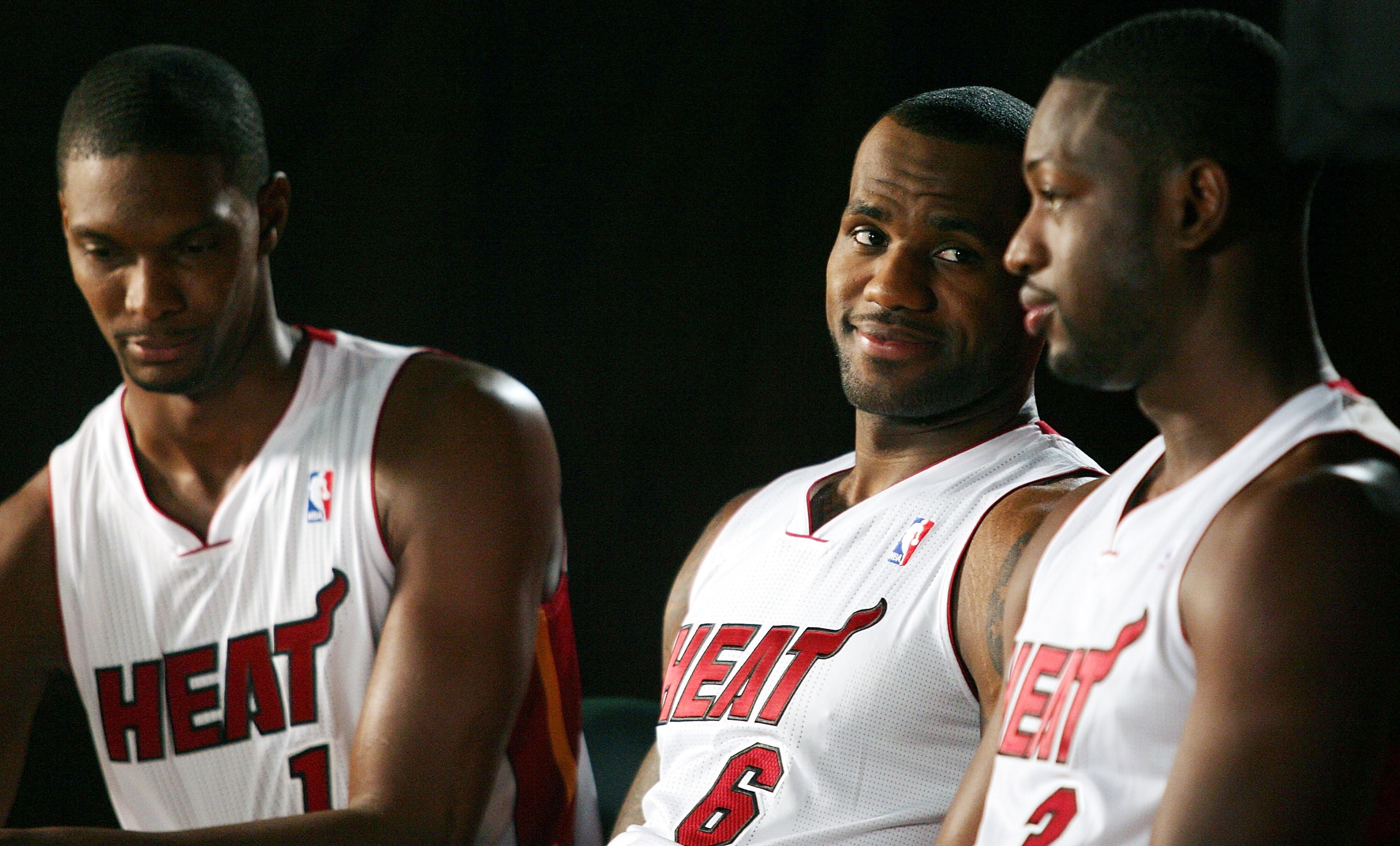 MIAMI - SEPTEMBER 27:  (L-R) Chris Bosh, LeBron James and Dwyane Wade of the Miami Heat answers questions during media day at the Bank United Center on September 27, 2010 in Miami, Florida.  (Photo by Marc Serota/Getty Images)