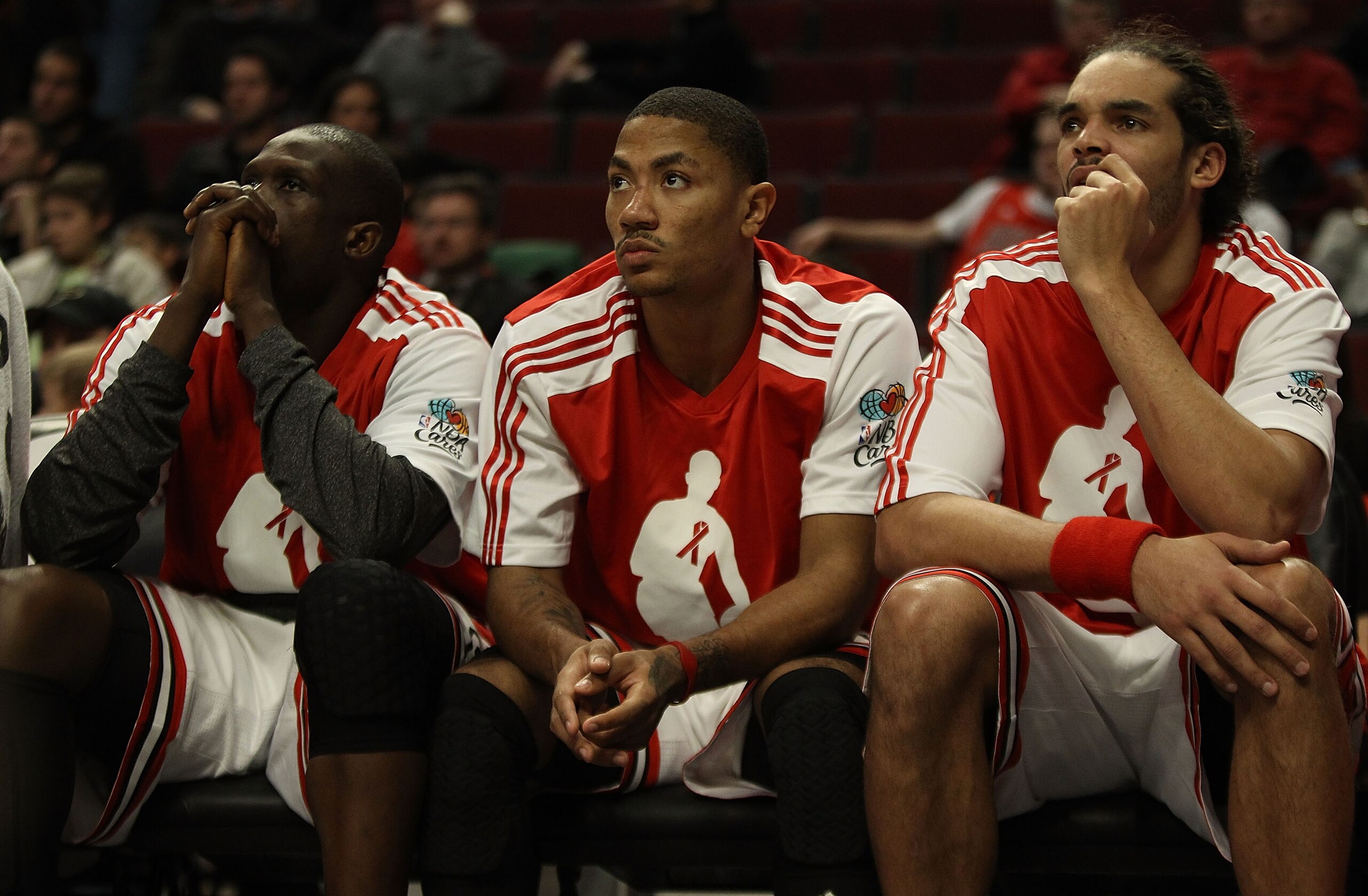 CHICAGO, IL - DECEMBER 01: (L-R) Loul Deng #9, Derrick Rose #1 and Joakim Noah #13 of the Chicago Bulls watch their teammates during a loss to the Orlando Magic at the United Center on December 1, 2010 in Chicago, Illinois. The Magic defeated the Bulls 10