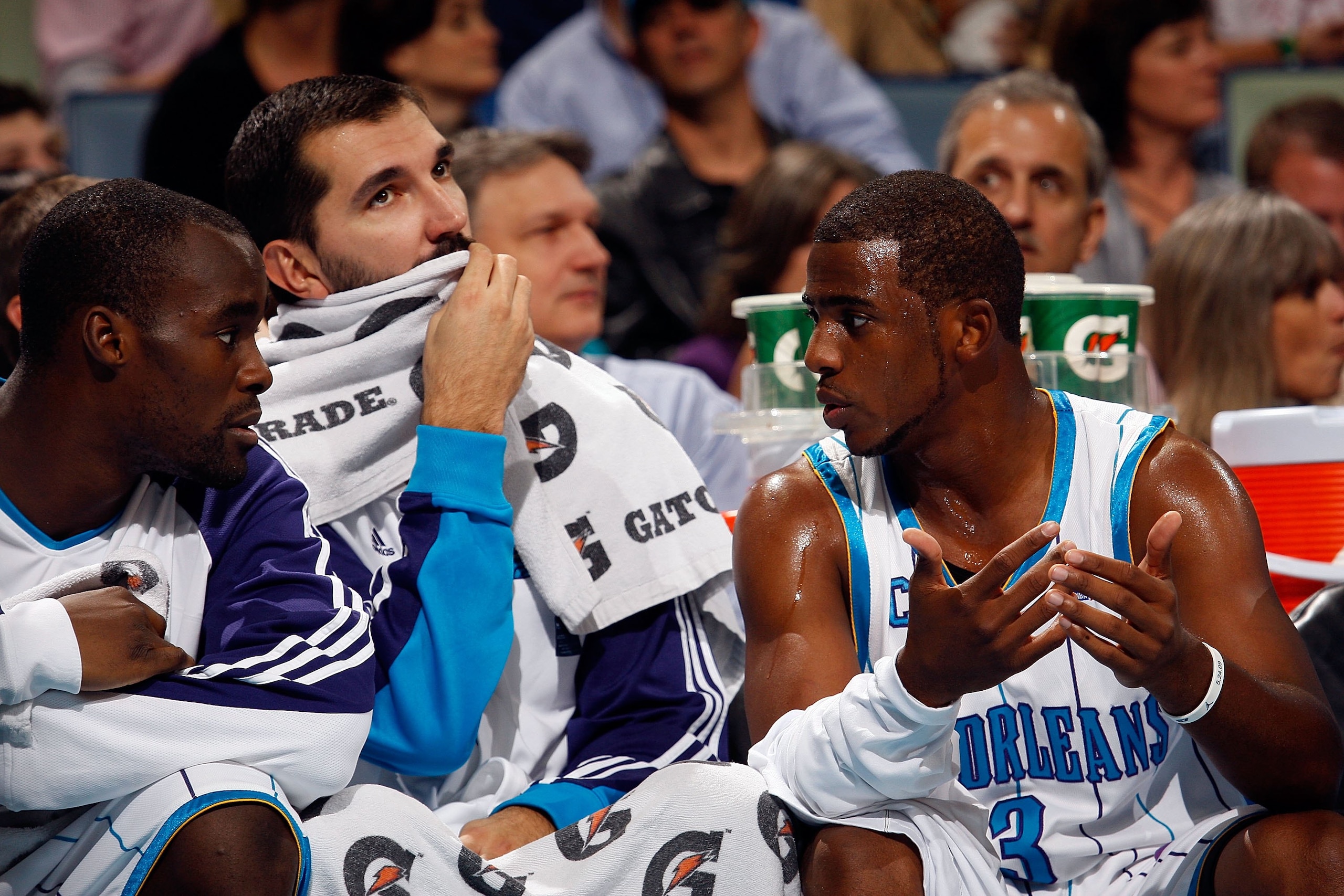 NEW ORLEANS - NOVEMBER 13:  Emeka Okafor #50, Peja Stojakovic #16 and Chris Paul #3 of the New Orleans Hornets talk on the bench during the game against the Portland Trail Blazers at the New Orleans Arena on November 13, 2009 in New Orleans, Louisiana.  N
