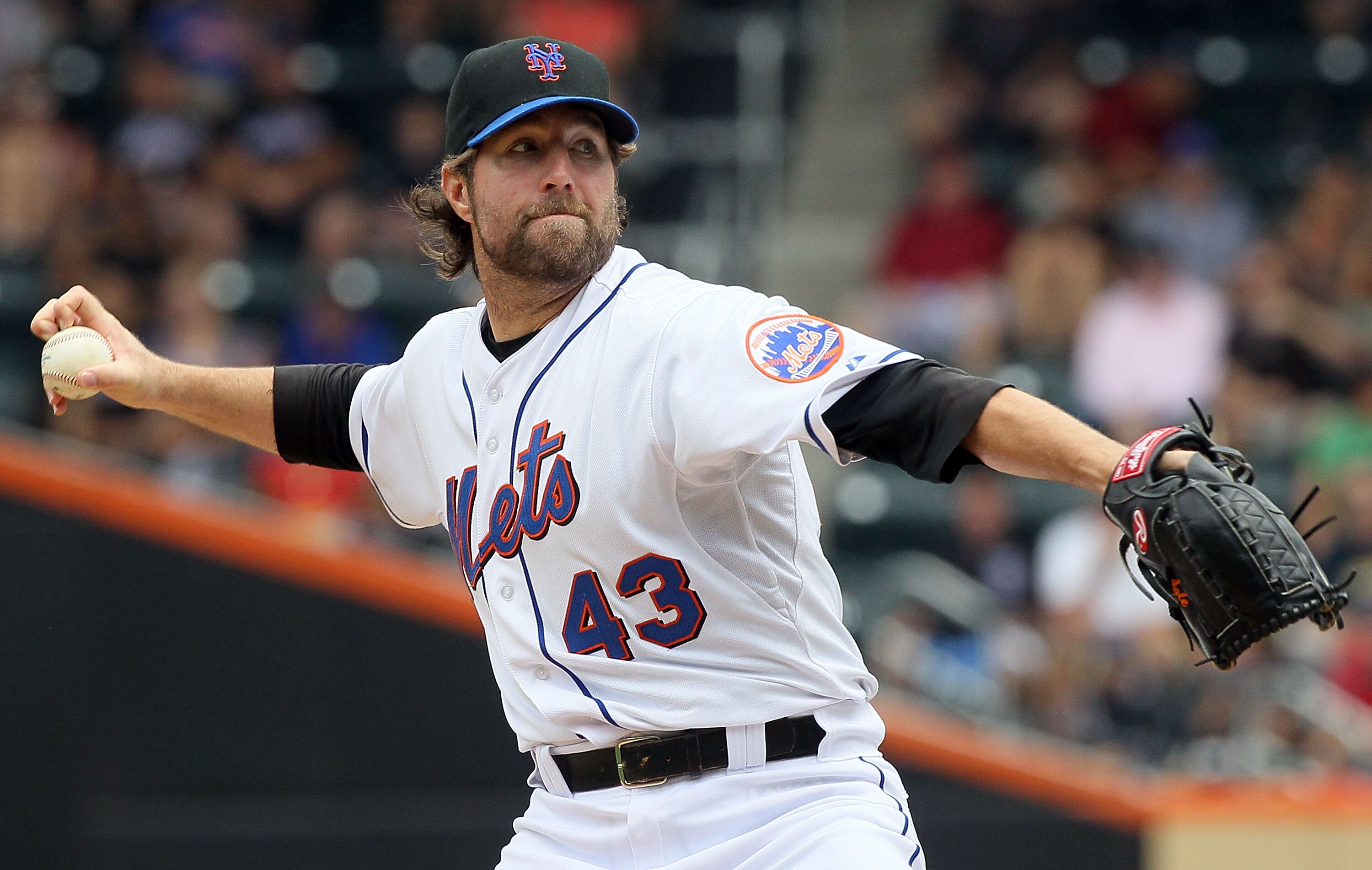 NEW YORK - JULY 29:  R.A. Dickey #43 of the New York Mets delivers a pitch against the St. Louis Cardinals on July 29, 2010 at Citi Field in the Flushing neighborhood of the Queens borough of New York City.  (Photo by Jim McIsaac/Getty Images)