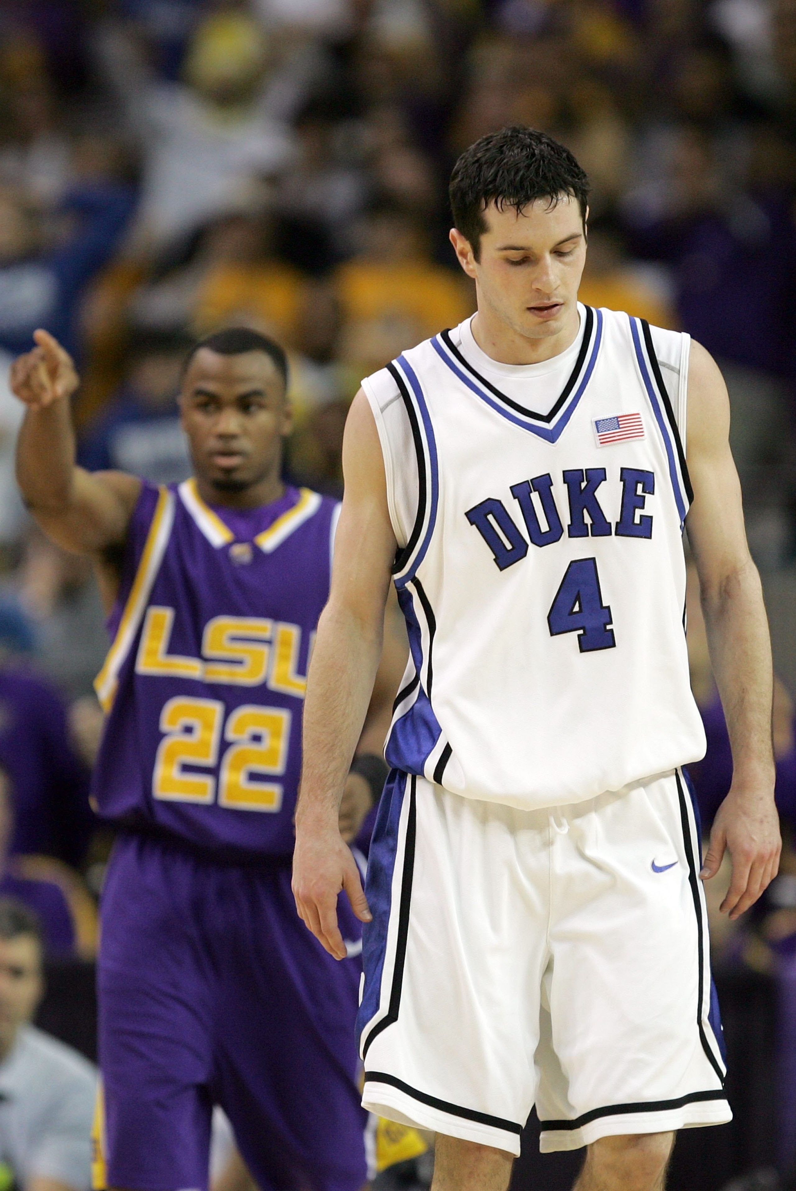 ATLANTA - MARCH 23: J.J. Redick #4 of the Duke Blue Devils and Darrel Mitchell #22 of the LSU Tigers walk down court during third round game of the 2006 NCAA Division I Men's Basketball Tournament Regional at the Georgia Dome on March 23, 2006 in Atlant ATLANTA - MARCH 23: J.J. Redick #4 of the Duke Blue Devils and Darrel Mitchell #22 of the LSU Tigers walk down court during third round game of the 2006 NCAA Division I Men's Basketball Tournament Regional at the Georgia Dome on March 23, 2006 in Atlant