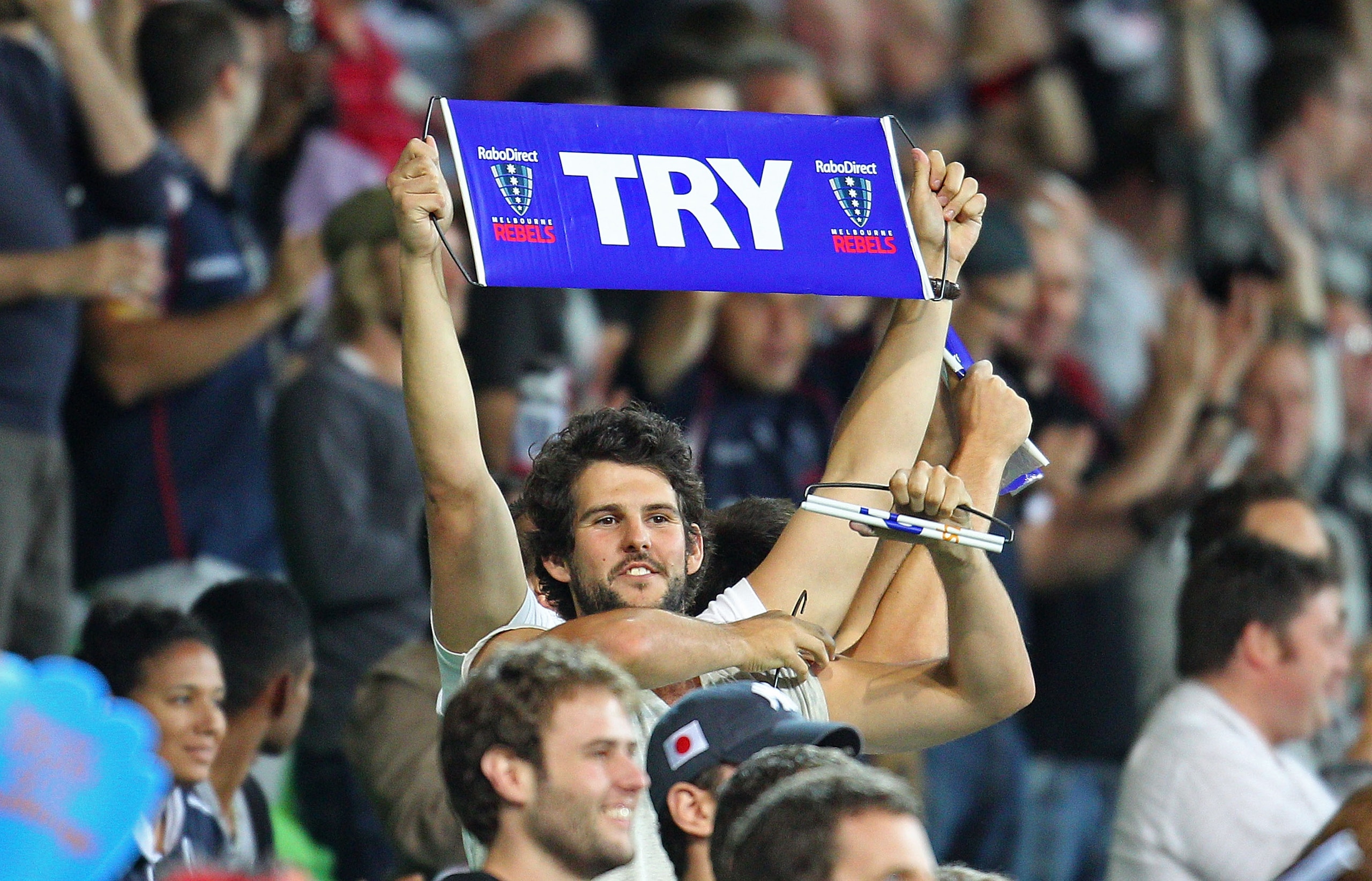 MELBOURNE, AUSTRALIA - FEBRUARY 25:  A Rebels supporter holds a sign aloft after Stirling Mortlock of the Rebels scored the Rebels first try during the round two Super Rugby match between the Melbourne Rebels and the Brumbies at AAMI Park on February 25,