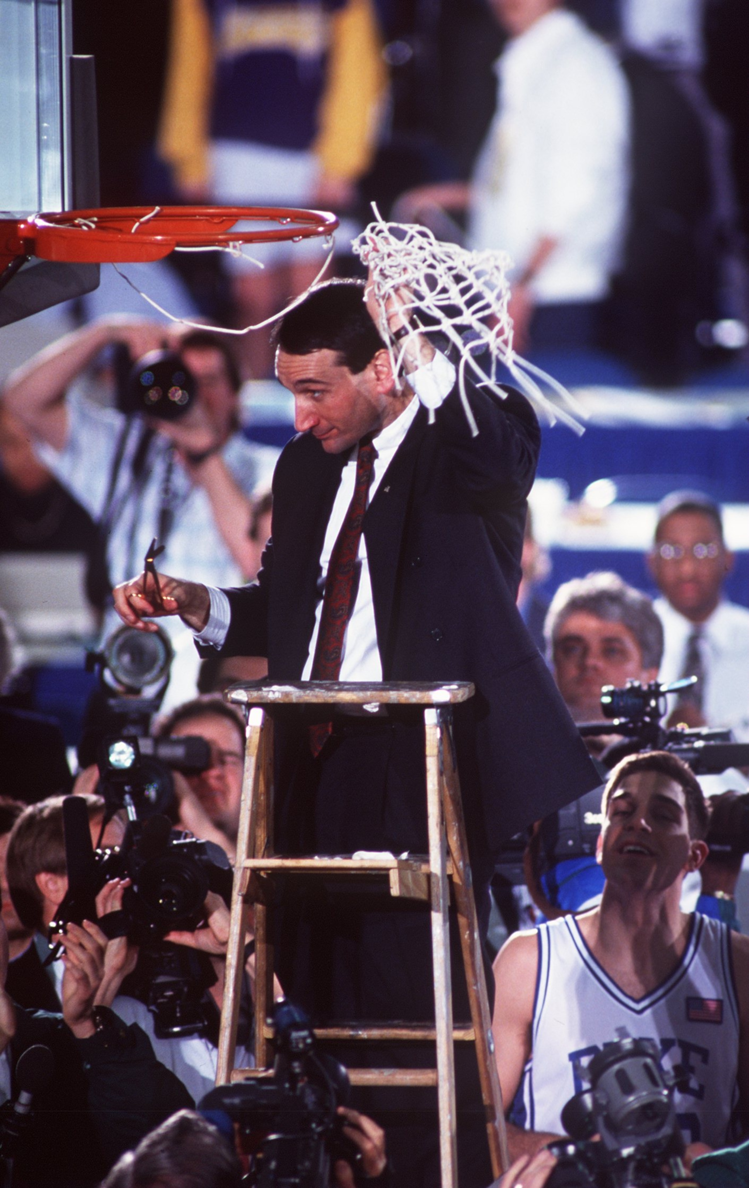 APR 1991: MIKE KRZYZEWSKI, HEAD COACH OF DUKE BASKETBALL, CUTS DOWN THE NET AFTER WINNING THE NCAA NATIONAL CHAMPIONSHIP. DUKE BEAT KANSAS 72-65 AT THE HOOSIER DOME, INDIANAPOLIS, INDIANA. Mandatory Credit: ALLSPORT USA/ALLSPORT APR 1991: MIKE KRZYZEWSKI, HEAD COACH OF DUKE BASKETBALL, CUTS DOWN THE NET AFTER WINNING THE NCAA NATIONAL CHAMPIONSHIP. DUKE BEAT KANSAS 72-65 AT THE HOOSIER DOME, INDIANAPOLIS, INDIANA. Mandatory Credit: ALLSPORT USA/ALLSPORT