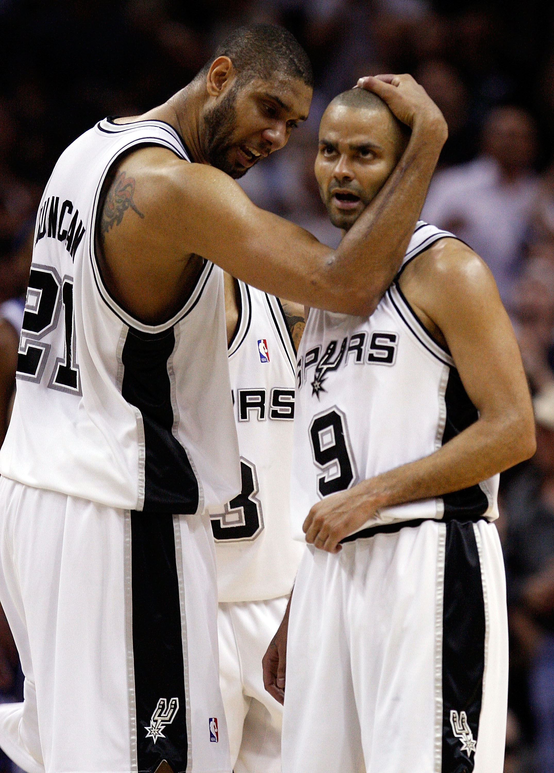 SAN ANTONIO - APRIL 23:  Forward Tim Duncan #21 and Tony Parker #9 of the San Antonio Spurs react during a 94-90 win against the Dallas Mavericks in Game Three of the Western Conference Quarterfinals during the 2010 NBA Playoffs at AT&T Center on April 23
