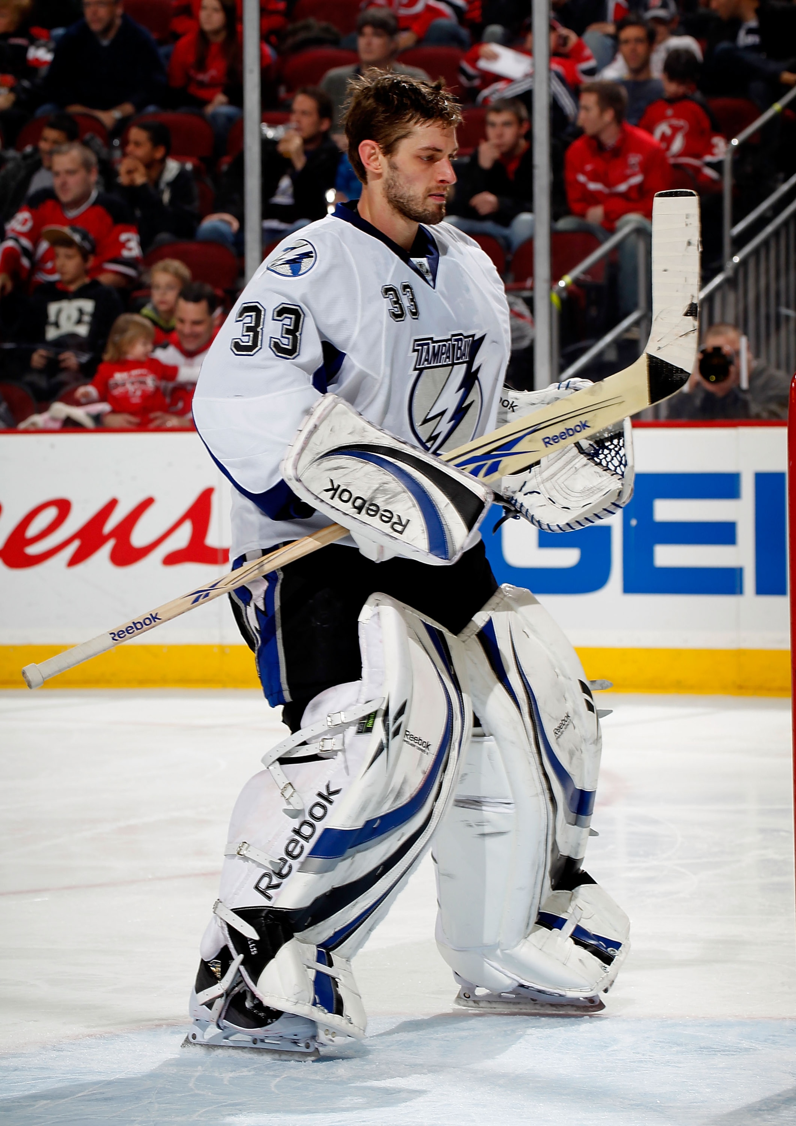 NEWARK, NJ - JANUARY 09: Goalie Dan Ellis #33 of the Tampa Bay Lightning skates without his mask during a break in action in an NHL hockey game against the New Jersey Devils at the Prudential Center on January 9, 2011 in Newark, New Jersey. (Photo by Pa NEWARK, NJ - JANUARY 09: Goalie Dan Ellis #33 of the Tampa Bay Lightning skates without his mask during a break in action in an NHL hockey game against the New Jersey Devils at the Prudential Center on January 9, 2011 in Newark, New Jersey. (Photo by Pa