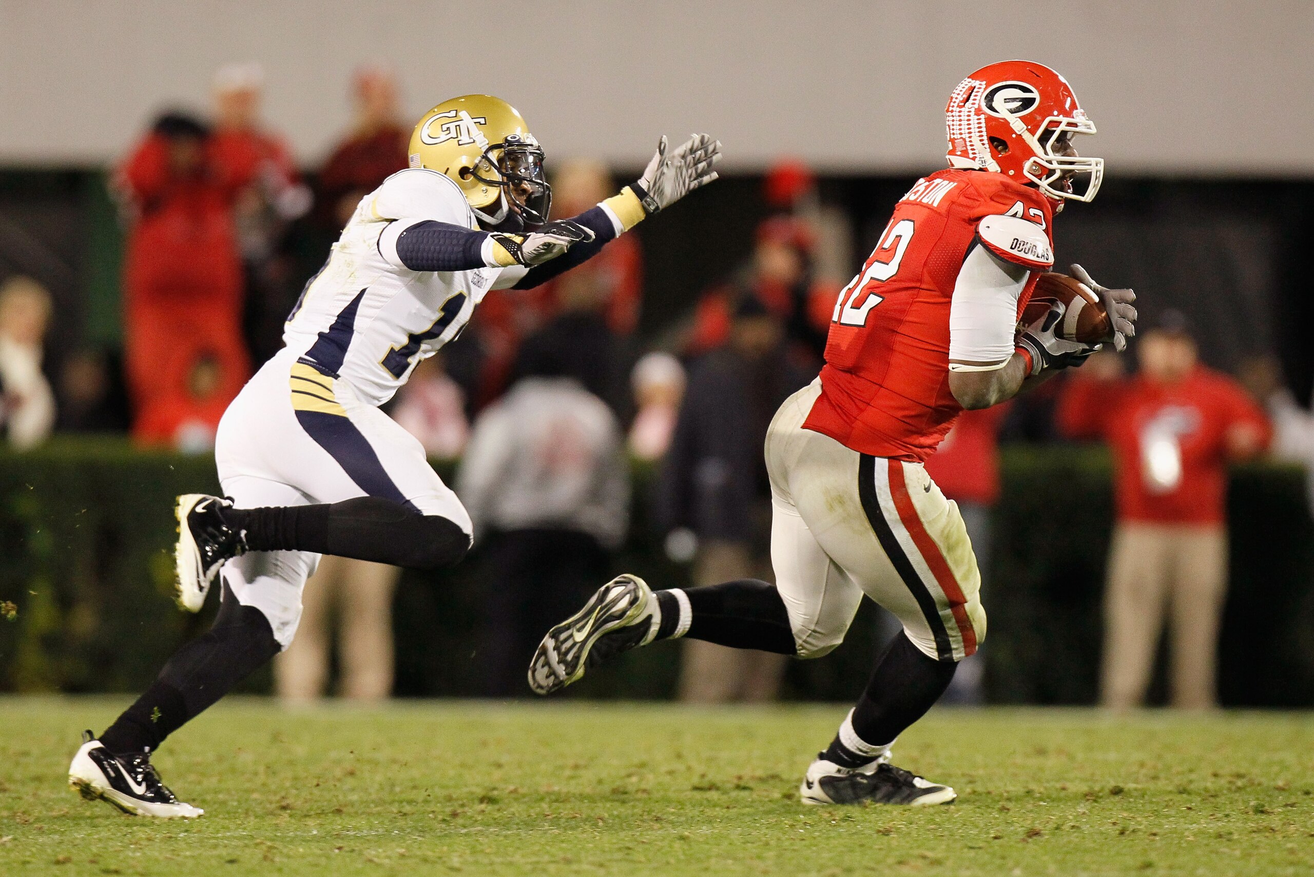 ATHENS, GA - NOVEMBER 27:  Justin Houston #42 of the Georgia Bulldogs intercepts a pass intended for Correy Earls #15 of the Georgia Tech Yellow Jackets in the final seconds of regulation at Sanford Stadium on November 27, 2010 in Athens, Georgia.  (Photo