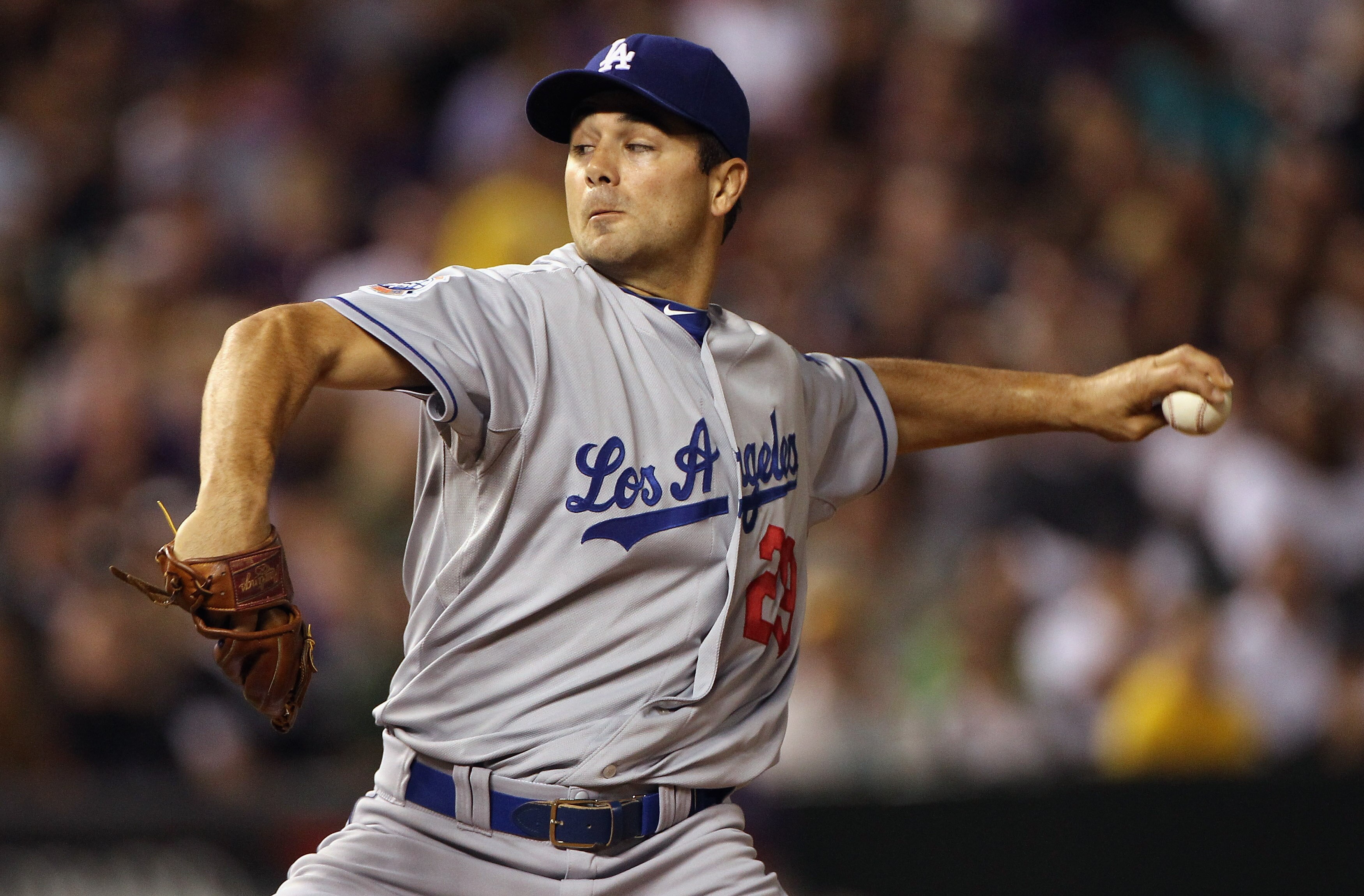 DENVER - SEPTEMBER 27:  Starting pitcher Ted Lilly #29 of the Los Angeles Dodgers delivers against the Colorado Rockies at Coors Field on September 25, 2010 in Denver, Colorado.  (Photo by Doug Pensinger/Getty Images)