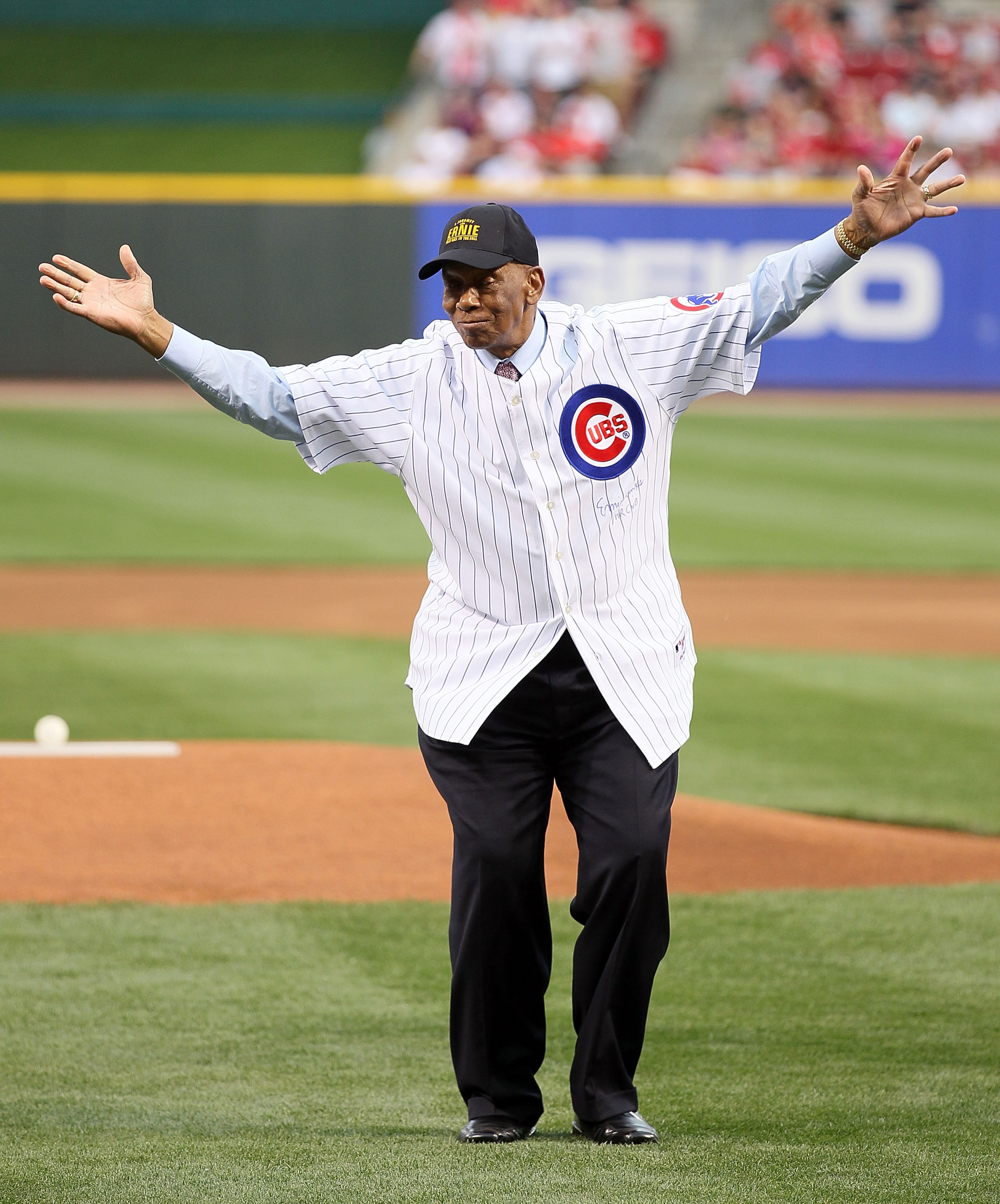 CINCINNATI - MAY 15:  Ernie Banks waves to the crowd after throwing out the first pitch before the Gillette Civil Rights Game between the Cincinnati Reds and the St. Louis Cardinals at Great American Ball Park on May 15, 2010 in Cincinnati, Ohio.  (Photo