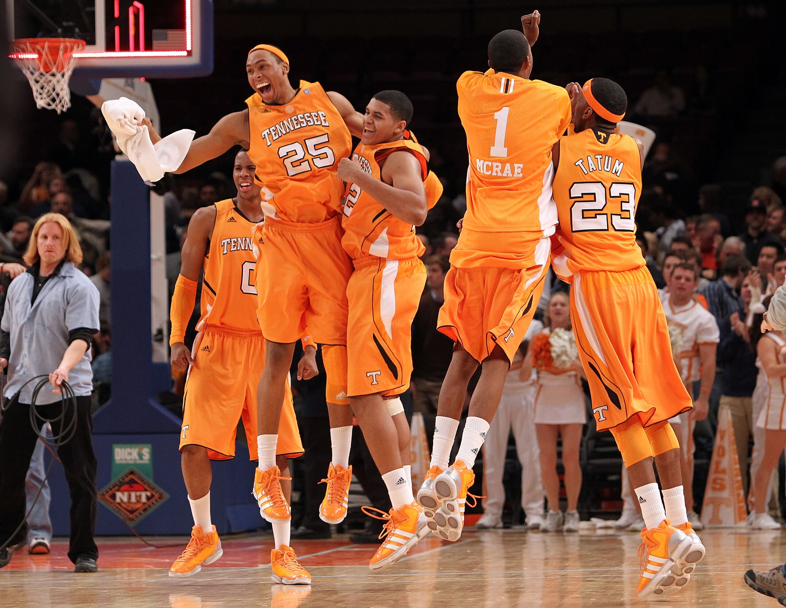 NEW YORK - NOVEMBER 26: John Fields #25 of the Tennessee Volunteers celebrates with teammate Tobias Harris #12 alongside Jordan McRae #1 and Cameron Tatum #23 after they defeated the Villanova Wildcats  during the Championship game at Madison Square Garde