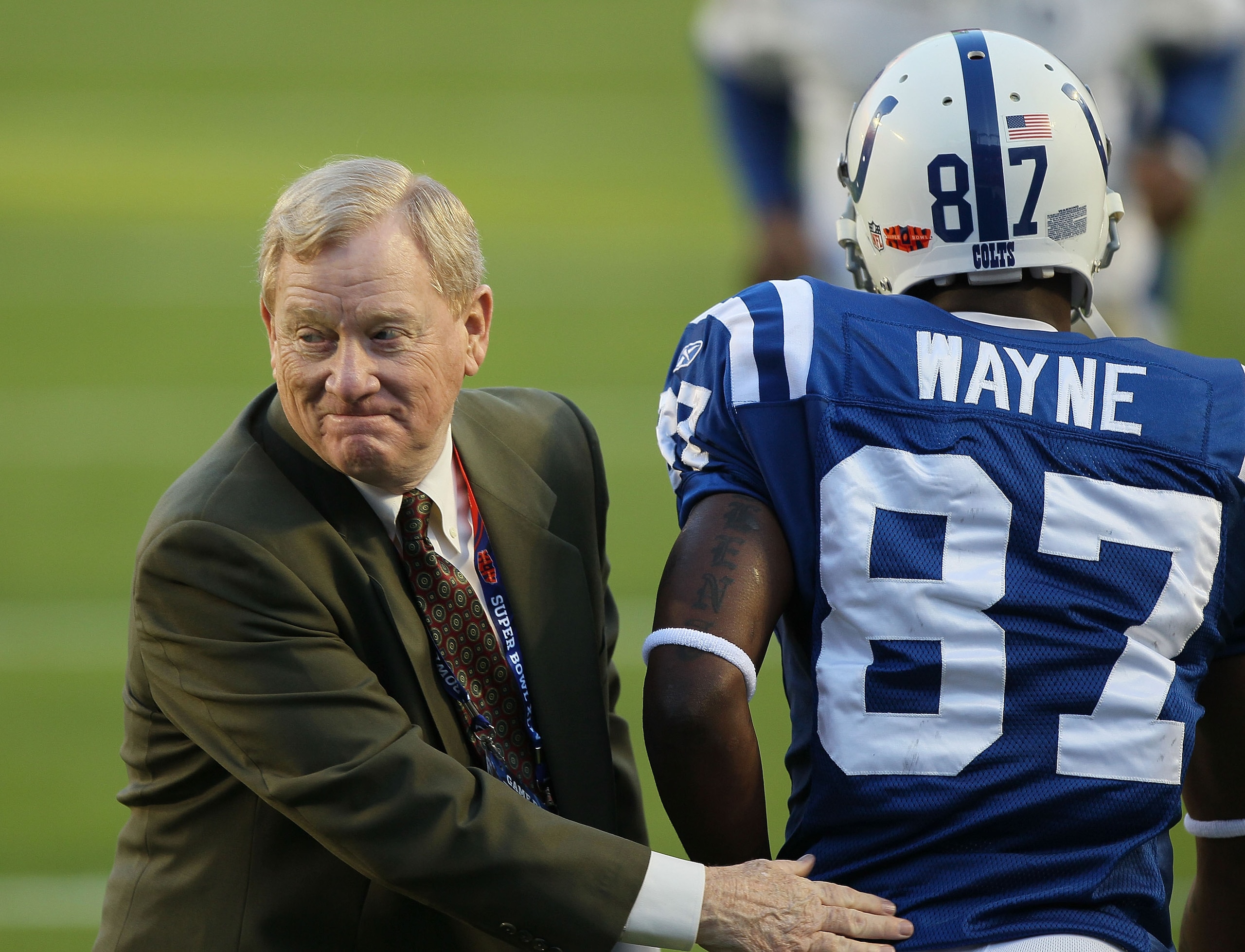 MIAMI GARDENS, FL - FEBRUARY 07: President of the Indianapolis Colts Bill Polian greets wide receiver Reggie Wayne #87 of the Indianapolis Colts on the field prior to Super Bowl XLIV against the New Orleans Saints on February 7, 2010 at Sun Life Stadium i