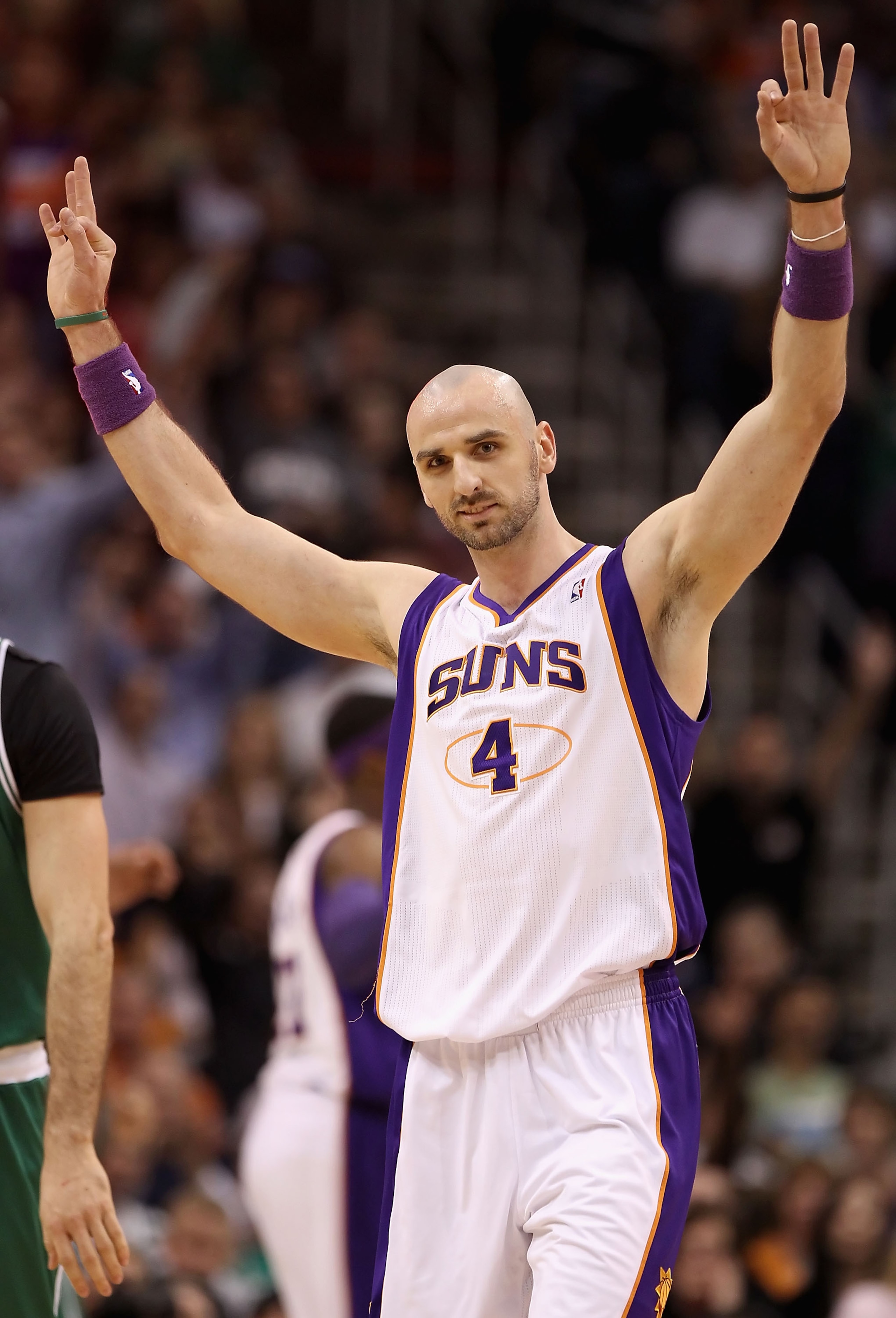 PHOENIX, AZ - JANUARY 28:  Marcin Gortat #4 of the Phoenix Suns reacts after hitting a three point shot at the end of the first quarter against the Boston Celtics during the NBA game at US Airways Center on January 28, 2011 in Phoenix, Arizona. The Suns d
