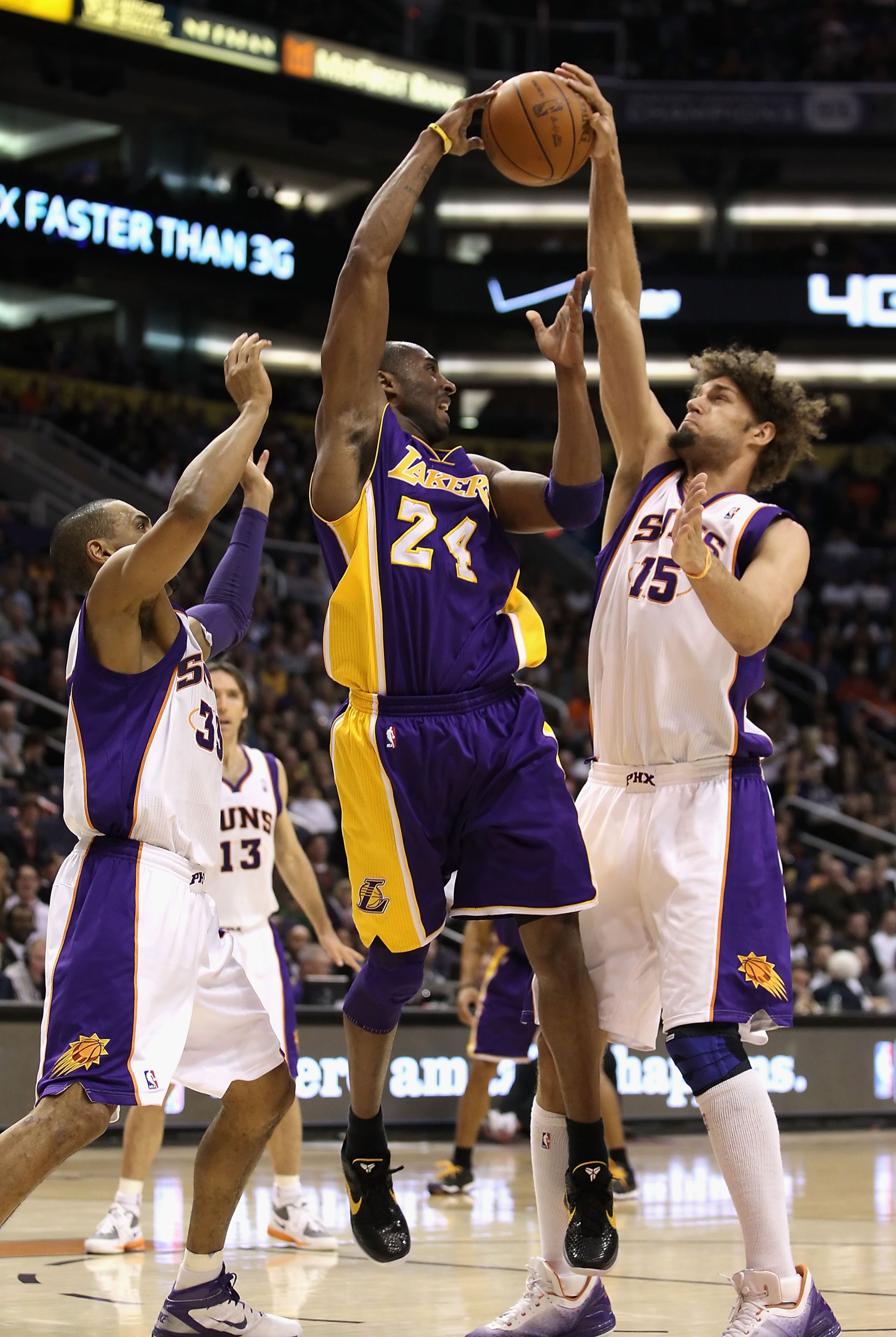 PHOENIX - JANUARY 05: Kobe Bryant #24 of the Los Angeles Lakers has his pass blocked by Robin Lopez #15 of the Phoenix Suns during the NBA game at US Airways Center on January 5, 2011 in Phoenix, Arizona. The Lakers defeated the Suns 99-95. NOTE TO USER: