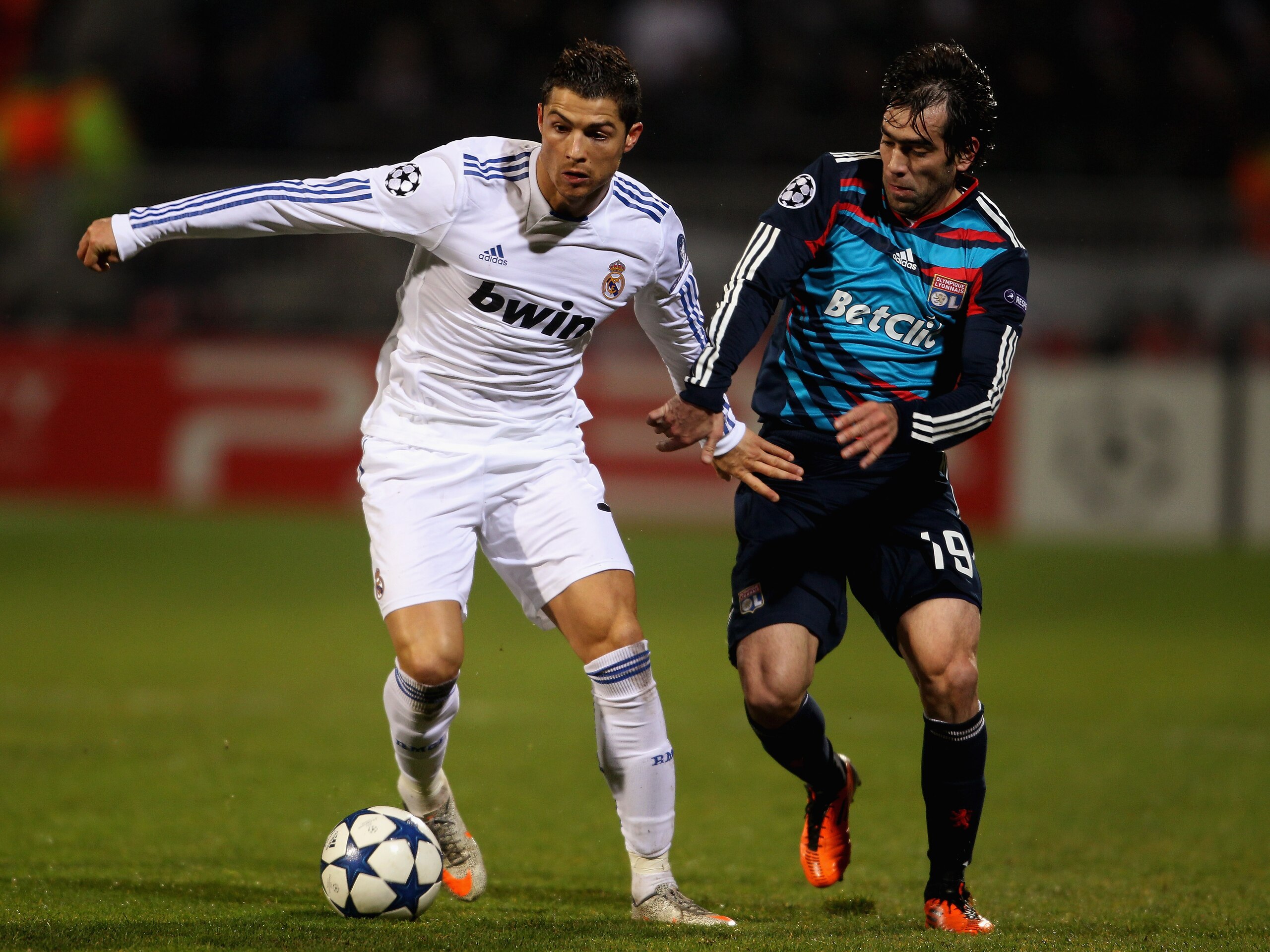 LYON, FRANCE - FEBRUARY 22:  Cristiano Ronaldo of Real Madrid (L) in action with Cesar Delgado of Lyon during the Champions League match between Lyon and Real Madrid at Stade Gerland on February 22, 2011 in Lyon, France.  (Photo by Scott Heavey/Getty Imag
