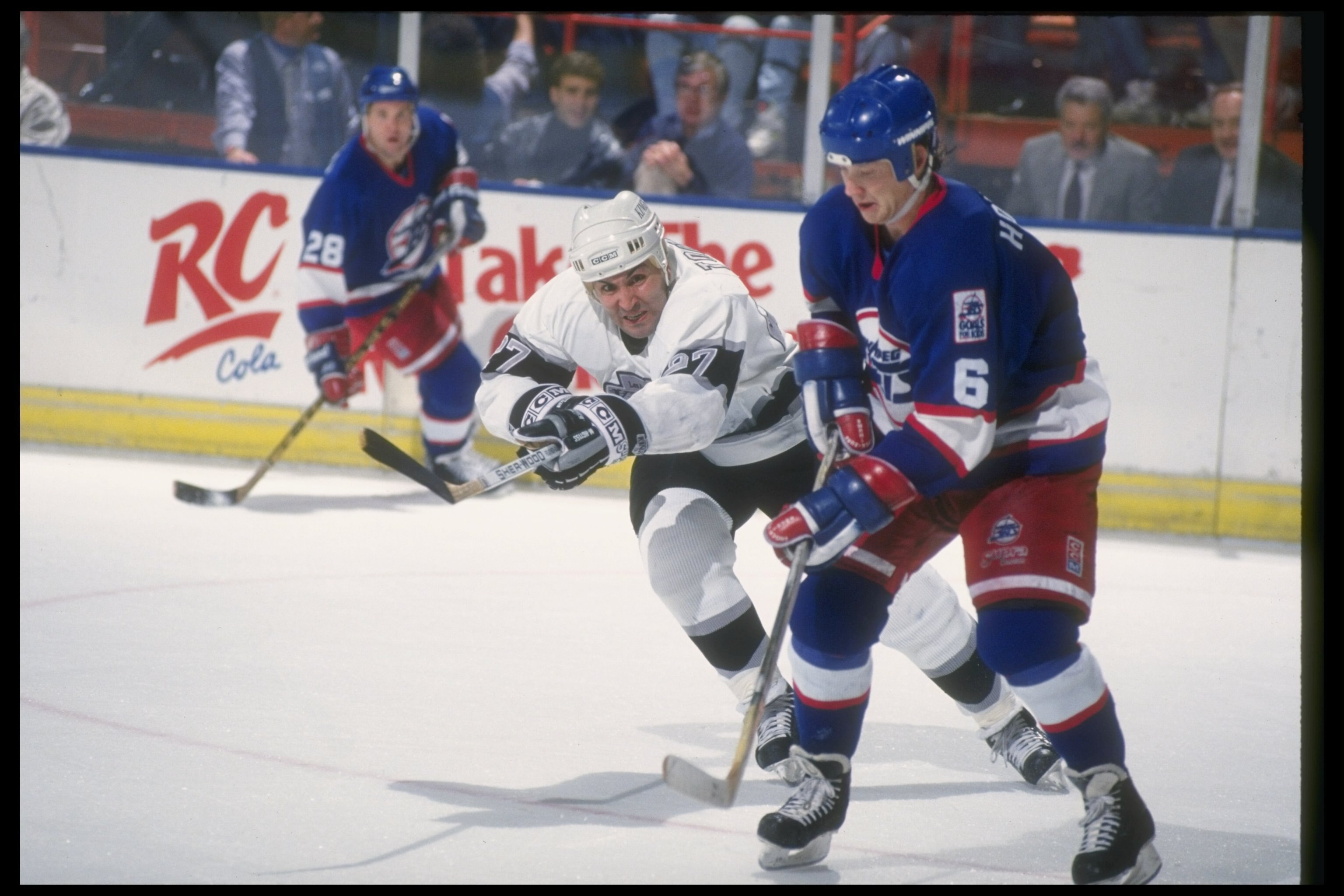 1990-1991:  Leftwinger John Tonelli of the Los Angeles Kings works against the Winnipeg Jets during a game at the Great Westen Forum in Inglewood, California. Mandatory Credit: Mike Powell  /Allsport
