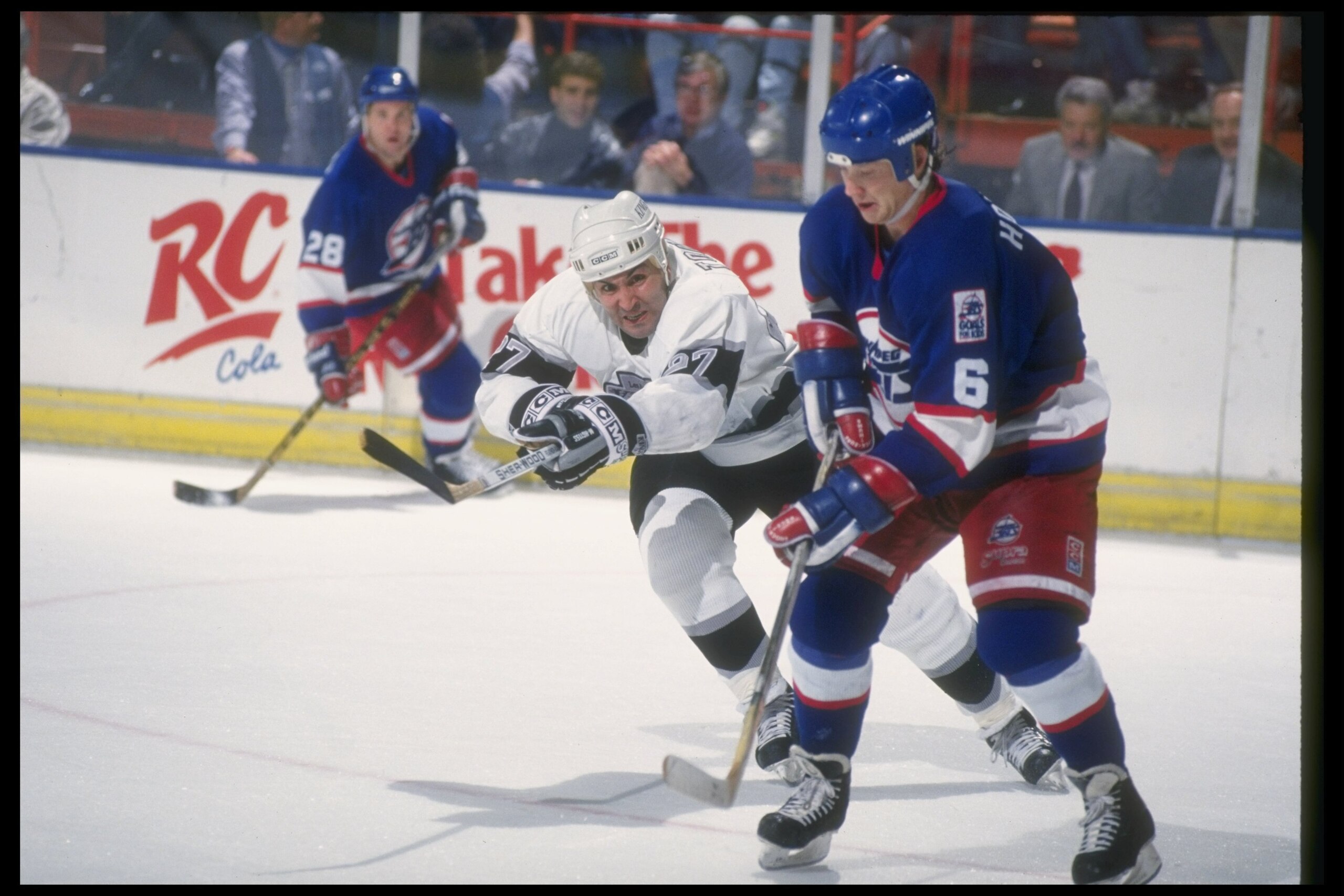 1990-1991:  Leftwinger John Tonelli of the Los Angeles Kings works against the Winnipeg Jets during a game at the Great Westen Forum in Inglewood, California. Mandatory Credit: Mike Powell  /Allsport