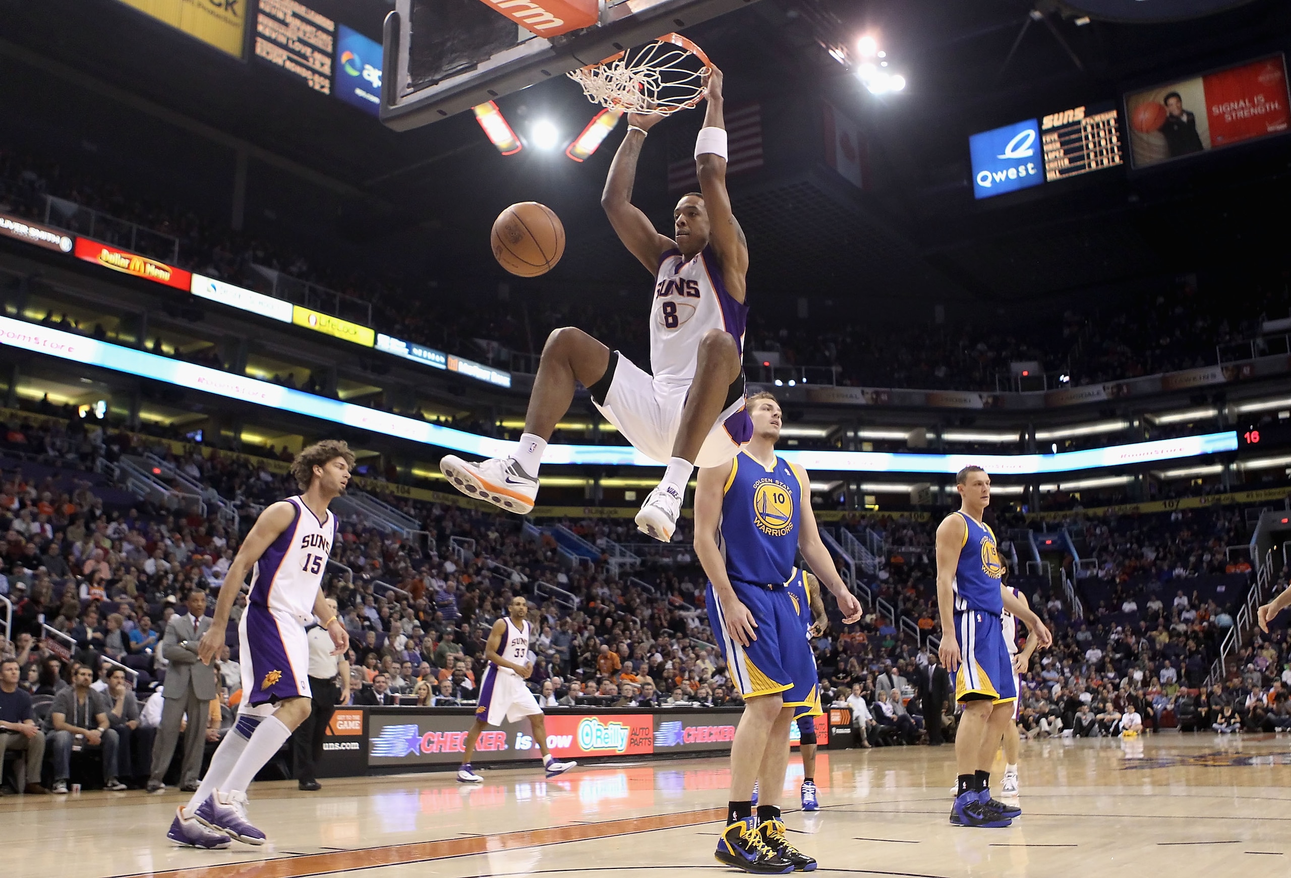 PHOENIX, AZ - FEBRUARY 10:  Channing Frye #8 of the Phoenix Suns slam dunks the ball against the Golden State Warriors during the NBA game at US Airways Center on February 10, 2011 in Phoenix, Arizona.  NOTE TO USER: User expressly acknowledges and agrees