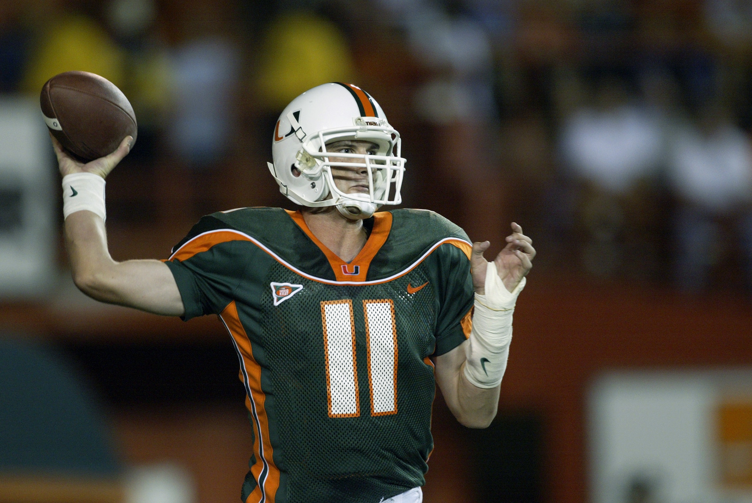 MIAMI, FL - NOVEMBER 21:  Ken Dorsey #11 of the University of Miami throws the ball against the University of Pittsburgh during the game at the Orange Bowl on November 21, 2002 in Miami, Florida. (Photo by Andy Lyons/Getty Images)