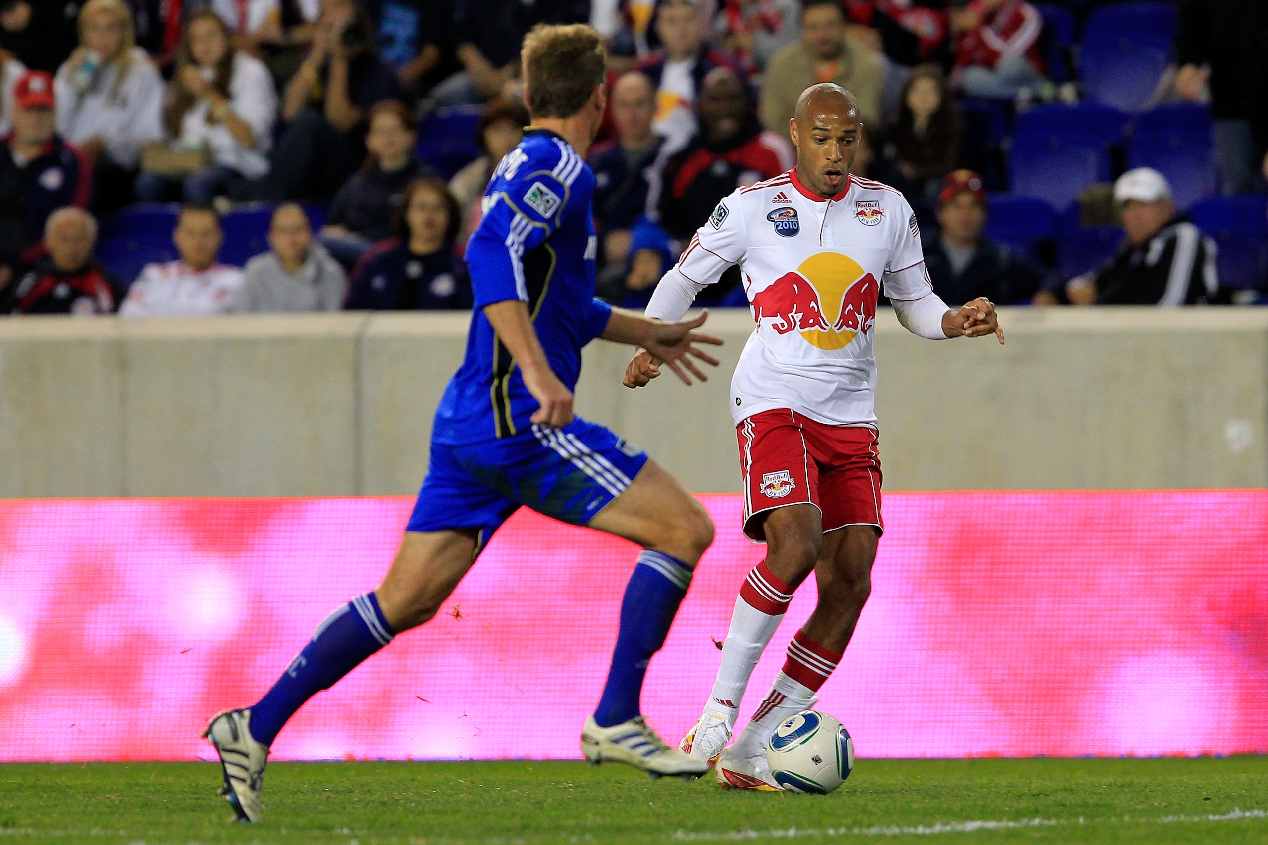 HARRISON, NJ - OCTOBER 02: Thierry Henry #14 of the New York Red Bulls controls the ball against Jimmy Conrad #12 of the Kansas City Wizards on October 2, 2010 at Red Bull Arena in Harrison, New Jersey. The Red Bulls defeated the Wizards 1-0. (Photo by Ch