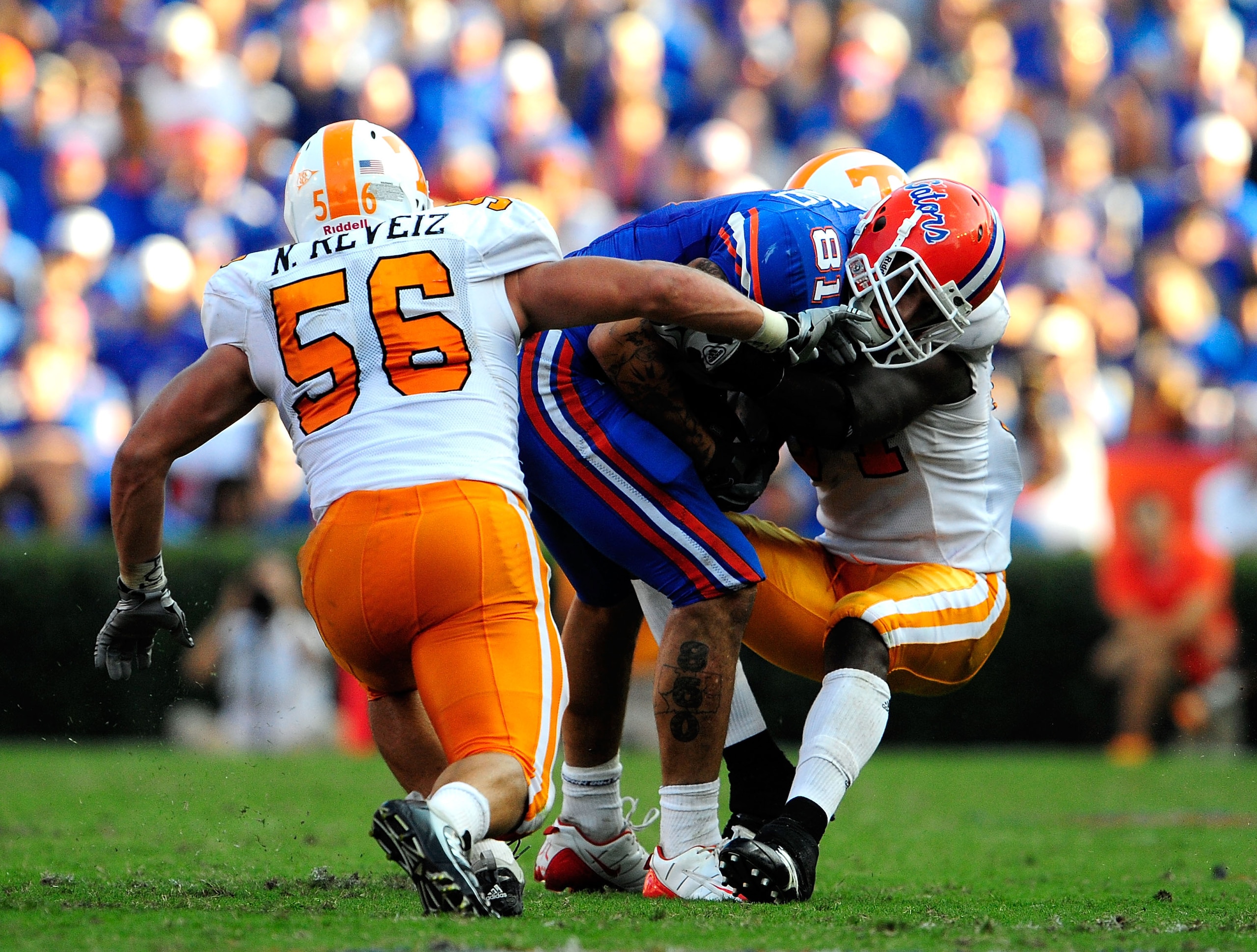 GAINESVILLE, FL - SEPTEMBER 19:  Aaron Hernandez #81 of the Florida Gators is tackled by Nick Reveiz #56 of the Tennessee Volunteers during the game at Ben Hill Griffin Stadium on September 19, 2009 in Gainesville, Florida.  (Photo by Sam Greenwood/Getty