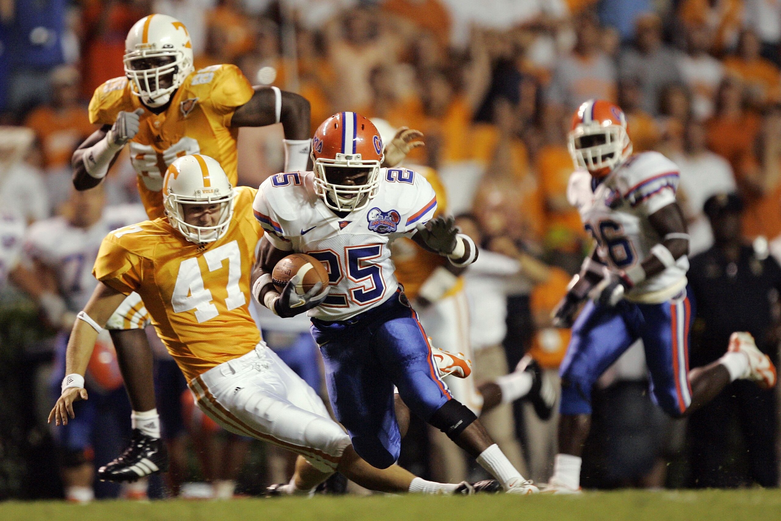 KNOXVILLE, TN - SEPTEMBER 16:  Punter Britton Colquitt #47 of the Tennessee Volunteers trips returner Brandon James #25 of the Florida Gators in the open field for a personal foul in the first quarter on September 16, 2006 at Neyland Stadium in Knoxville,