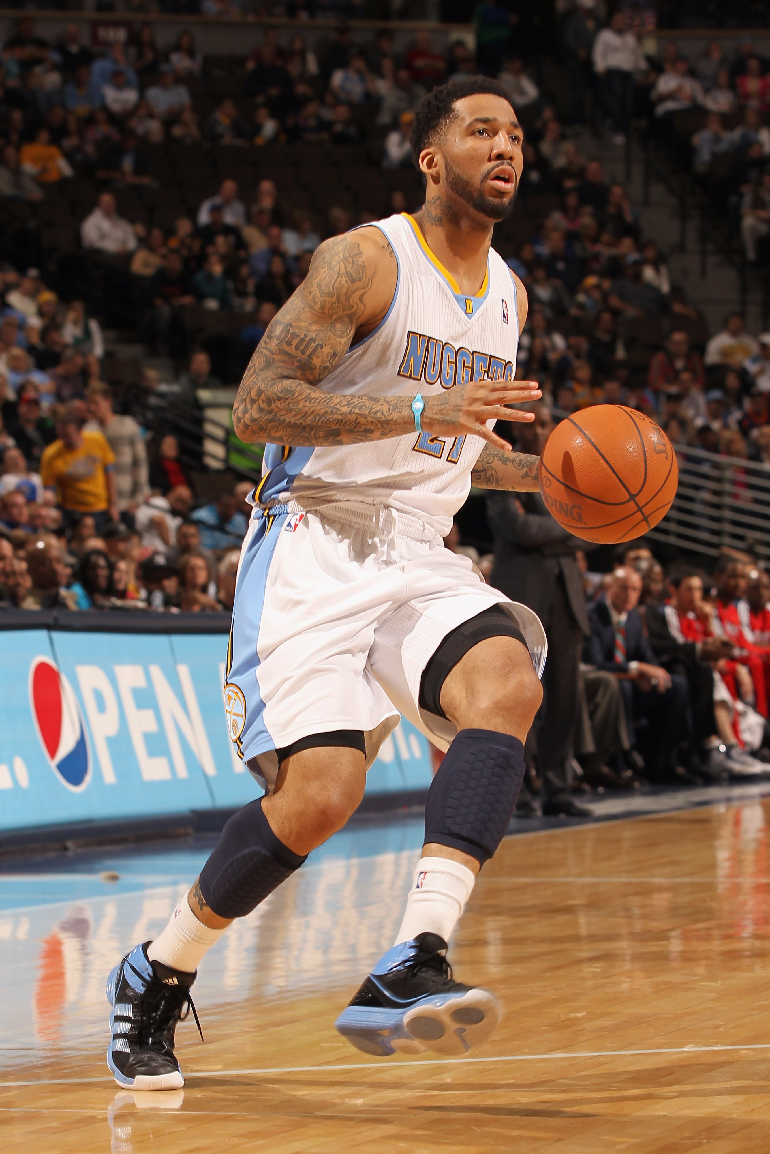 DENVER, CO - FEBRUARY 28: Wilson Chandler #21 of the Denver Nuggets controls the ball against the Atlanta Hawks during NBA action at the Pepsi Center on February 28, 2011 in Denver, Colorado. The Nuggets deafeated the Hawks 100-90. NOTE TO USER: User exp DENVER, CO - FEBRUARY 28: Wilson Chandler #21 of the Denver Nuggets controls the ball against the Atlanta Hawks during NBA action at the Pepsi Center on February 28, 2011 in Denver, Colorado. The Nuggets deafeated the Hawks 100-90. NOTE TO USER: User exp