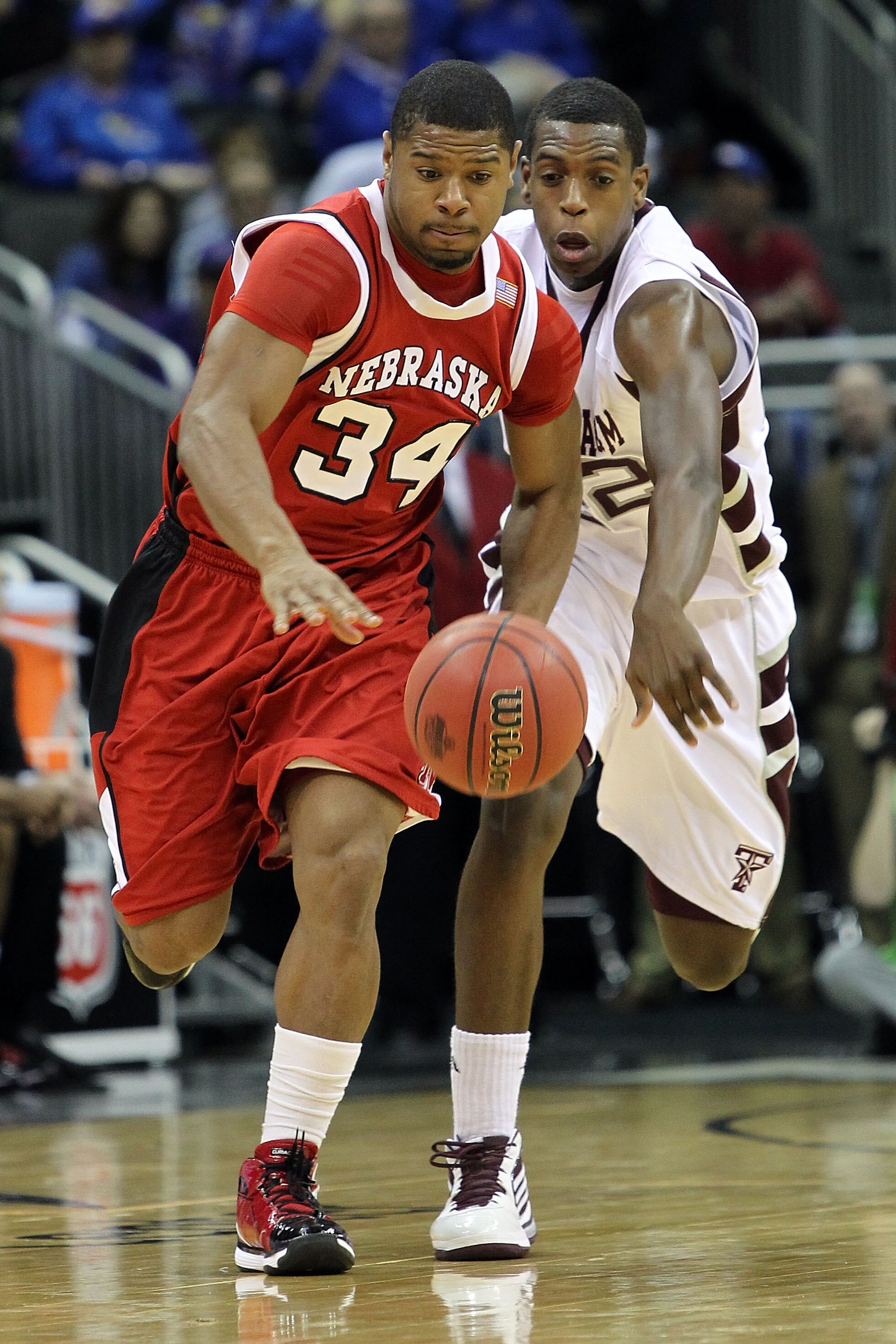 KANSAS CITY, MO - MARCH 11:  Lance Jeter #34 of the Nebraska Cornhuskers and Khris Middleton #22 of the Texas A&M Aggies go after the ball in the first half during the quarterfinals of the 2010 Phillips 66 Big 12 Men's Basketball Tournament at the Sprint