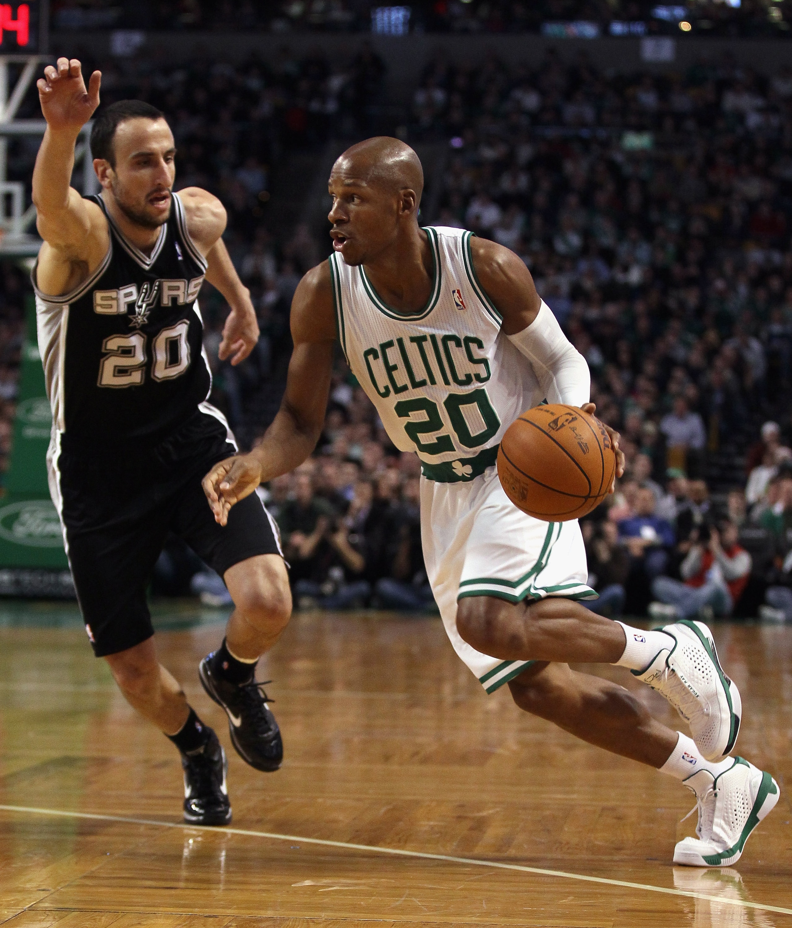 BOSTON, MA - JANUARY 05:  Ray Allen #20 of the Boston Celtics drives past Manu Ginobili #20 of the San Antonio Spurs on January 5, 2011 at the TD Garden in Boston, Massachusetts. NOTE TO USER: User expressly acknowledges and agrees that, by downloading an