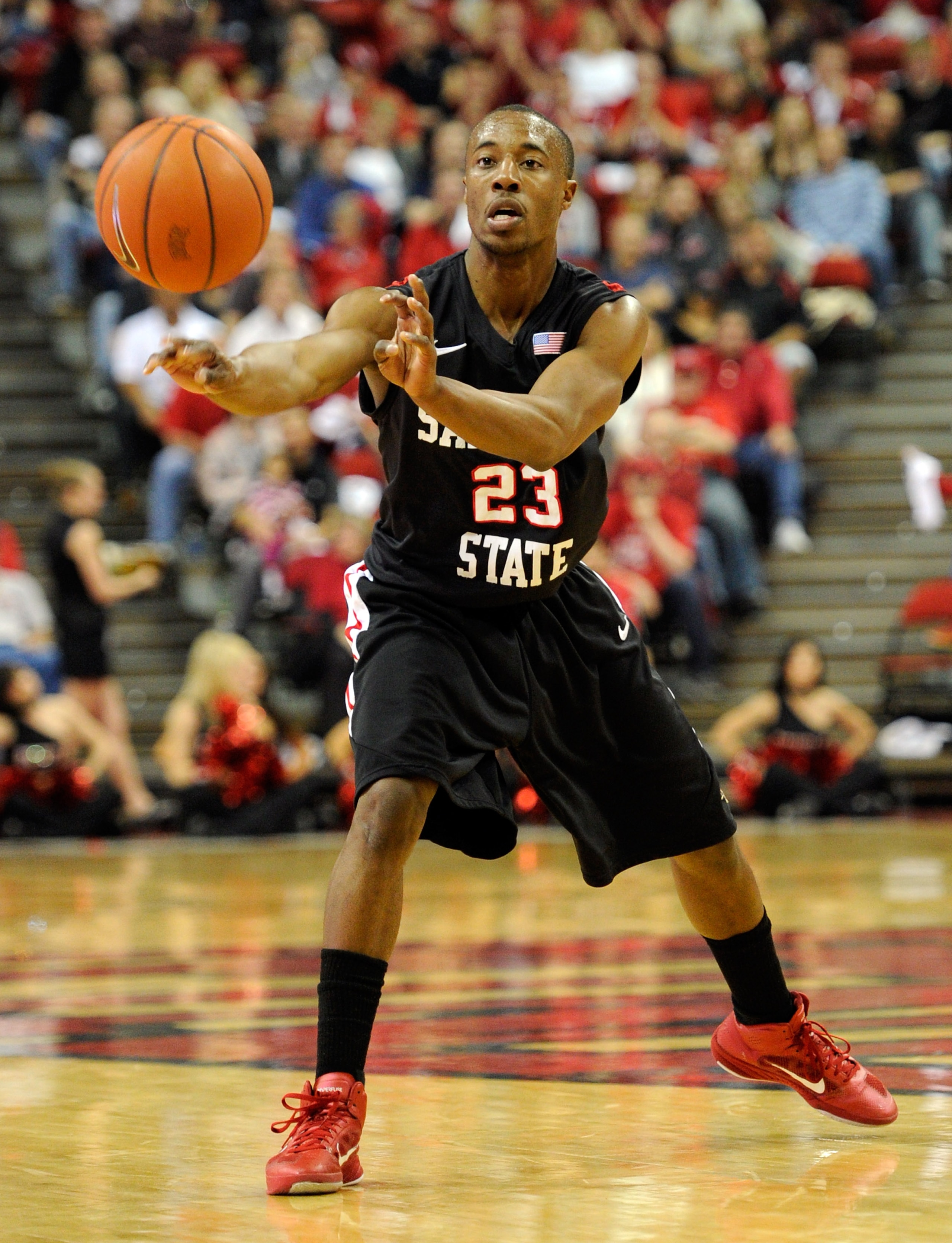 LAS VEGAS, NV - FEBRUARY 12:  D.J. Gay #23 of the San Diego State Aztecs passes the ball against the UNLV Rebels during their game at the Thomas & Mack Center February 12, 2011 in Las Vegas, Nevada. San Diego State won 63-57.  (Photo by Ethan Miller/Getty