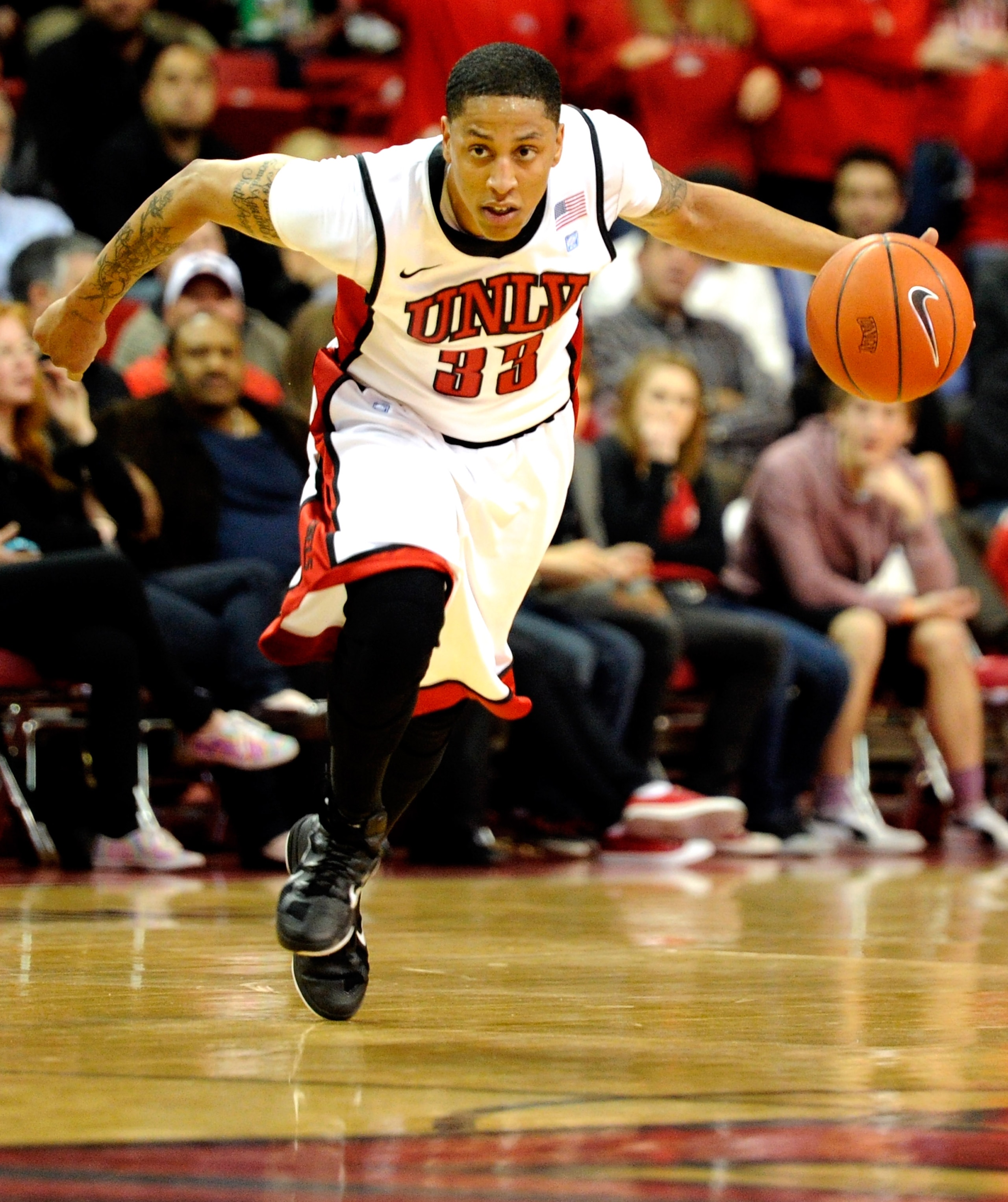 LAS VEGAS, NV - DECEMBER 30:  Tre'Von Willis #33 of the UNLV Rebels brings the ball up the court against the Central Michigan Chippewas during their game at the Thomas & Mack Center December 30, 2010 in Las Vegas, Nevada. UNLV won 73-47.  (Photo by Ethan