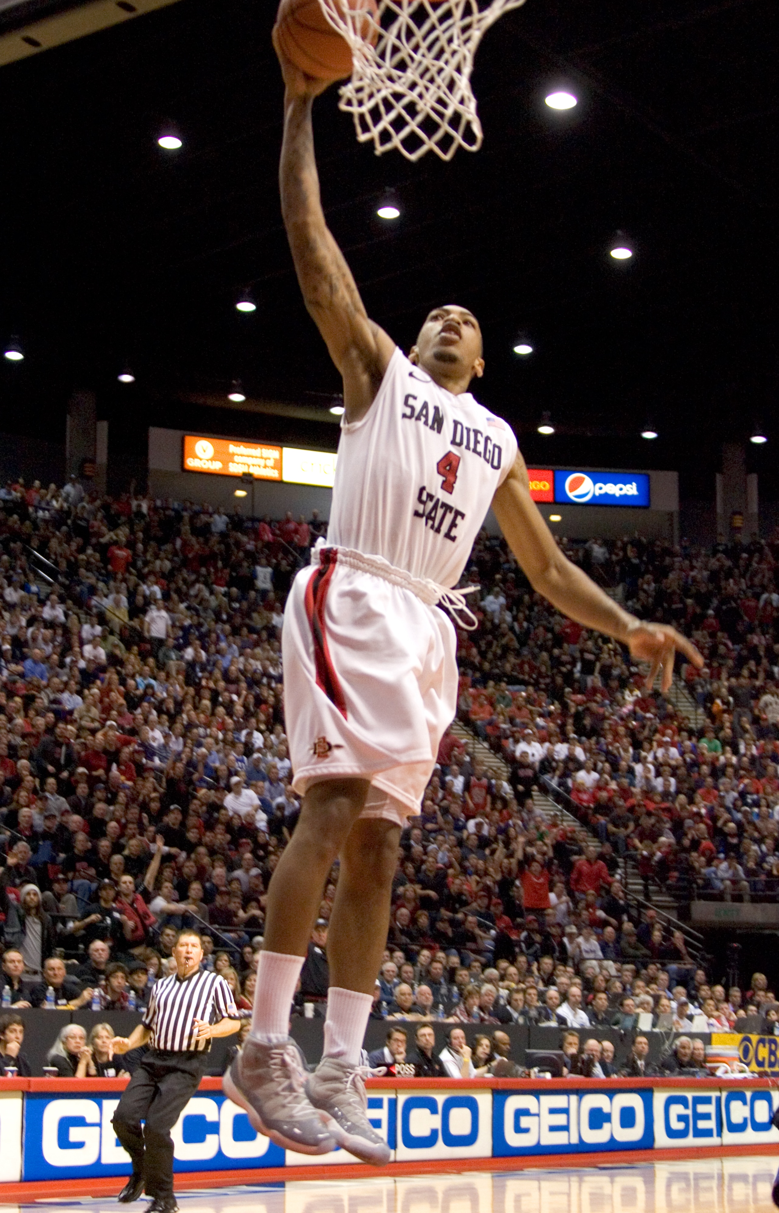SAN DIEGO, CA - FEBRUARY 26:  Malcolm Thomas #4 of the San Diego State Aztecs dunks the ball against the Brigham Young Cougars during the second half at Cox Arena on February 26, 2011 in San Diego, California. (Photo by Kent Horner/Getty Images)