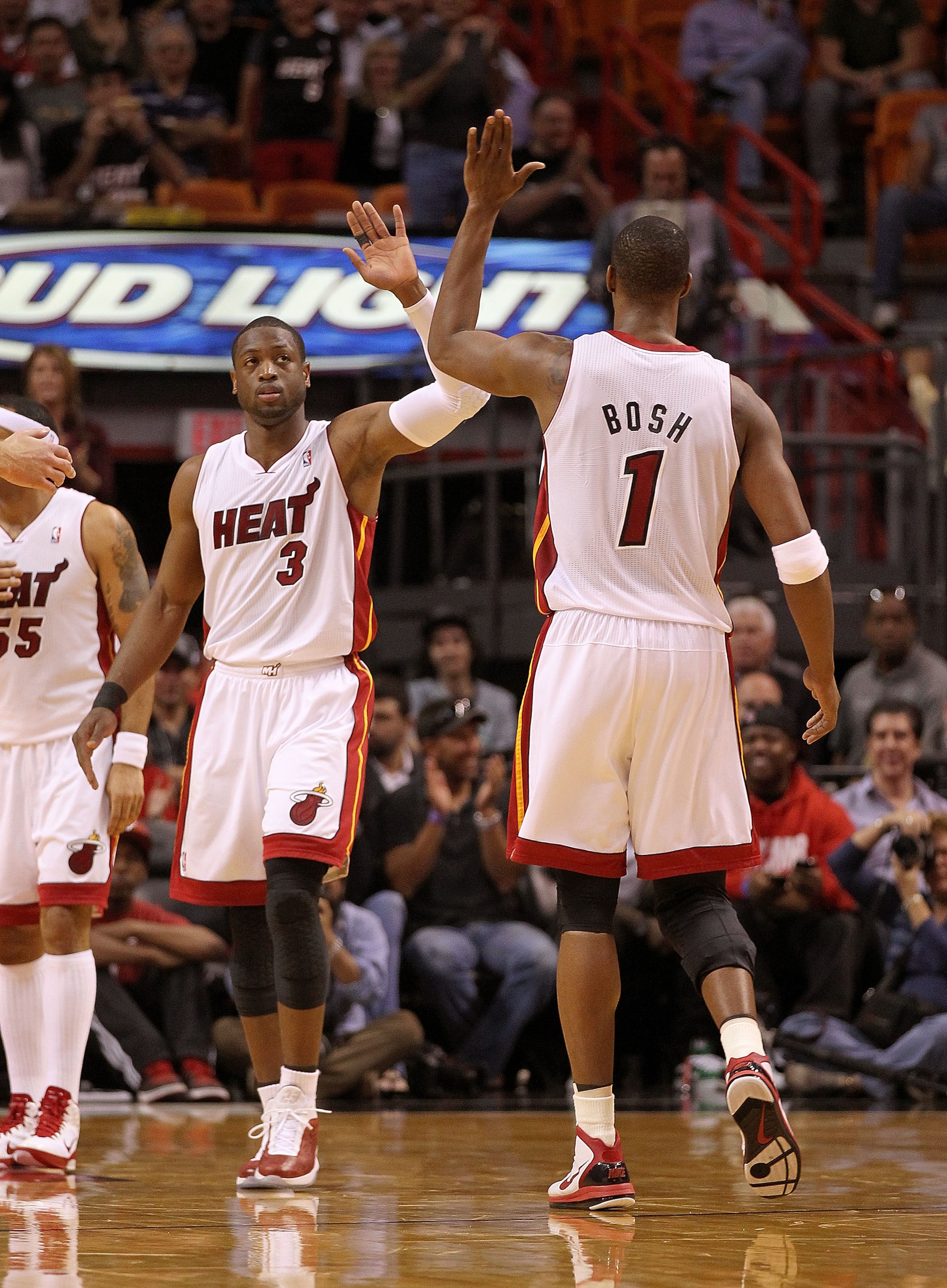 MIAMI, FL - FEBRUARY 25: Dwyane Wade #3 of the Miami Heat is congratulated by Chris Bosh #1 during a game against the Washington Wizards at American Airlines Arena on February 25, 2011 in Miami, Florida. NOTE TO USER: User expressly acknowledges and agre MIAMI, FL - FEBRUARY 25: Dwyane Wade #3 of the Miami Heat is congratulated by Chris Bosh #1 during a game against the Washington Wizards at American Airlines Arena on February 25, 2011 in Miami, Florida. NOTE TO USER: User expressly acknowledges and agre
