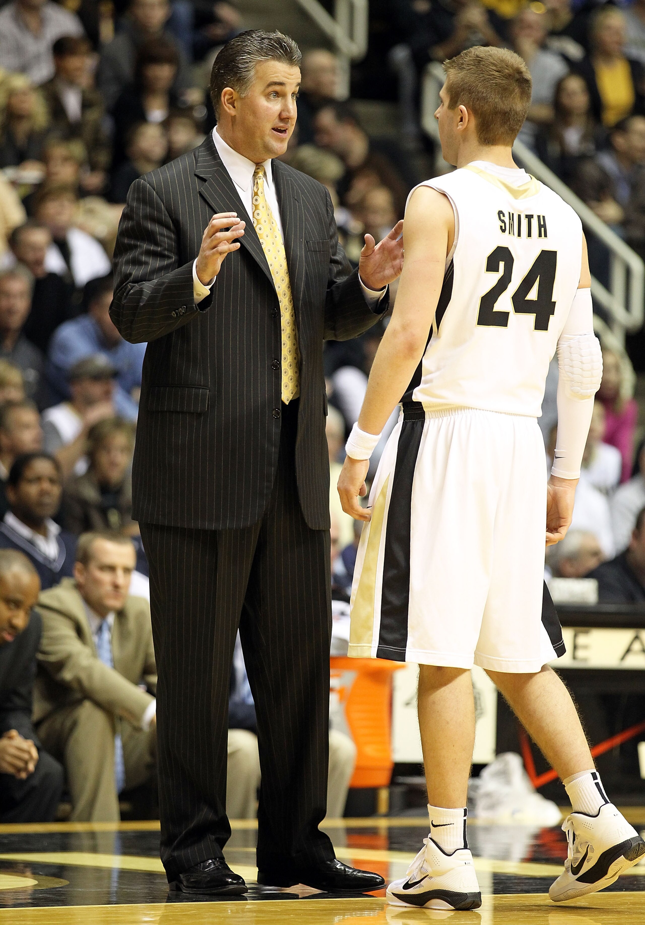 WEST LAFAYETTE, IN - JANUARY 09:  Matt Painter the Head Coach of the Purdue Boilermakers gives instructions to Ryne Smith #24 during the Big Ten Conference game against the Iowa Hawkeyes at Mackey Arena on January 9, 2011 in West Lafayette, Indiana.  Purd