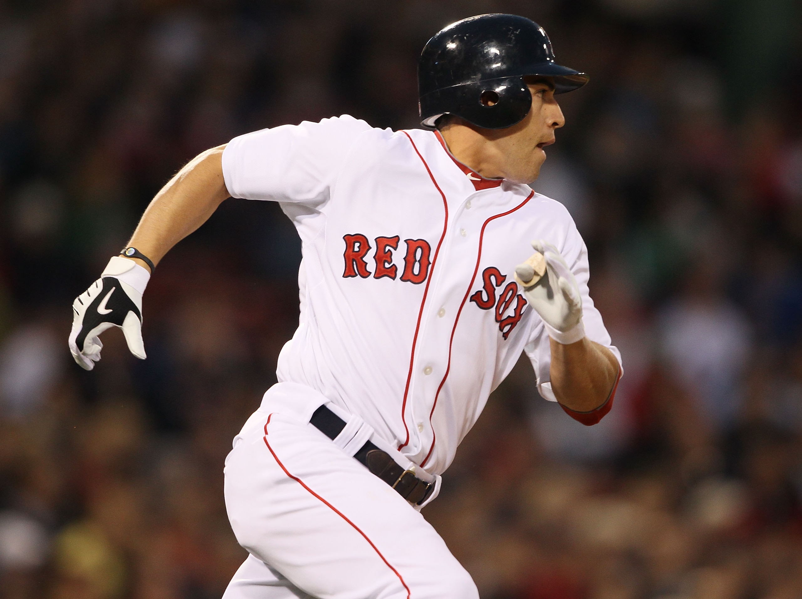 BOSTON - APRIL 06:  Jacoby Ellsbury #2 of the Boston Red Sox heads to first base in the first inning against the New York Yankees on April 6, 2010 at Fenway Park in Boston, Massachusetts.  (Photo by Elsa/Getty Images)