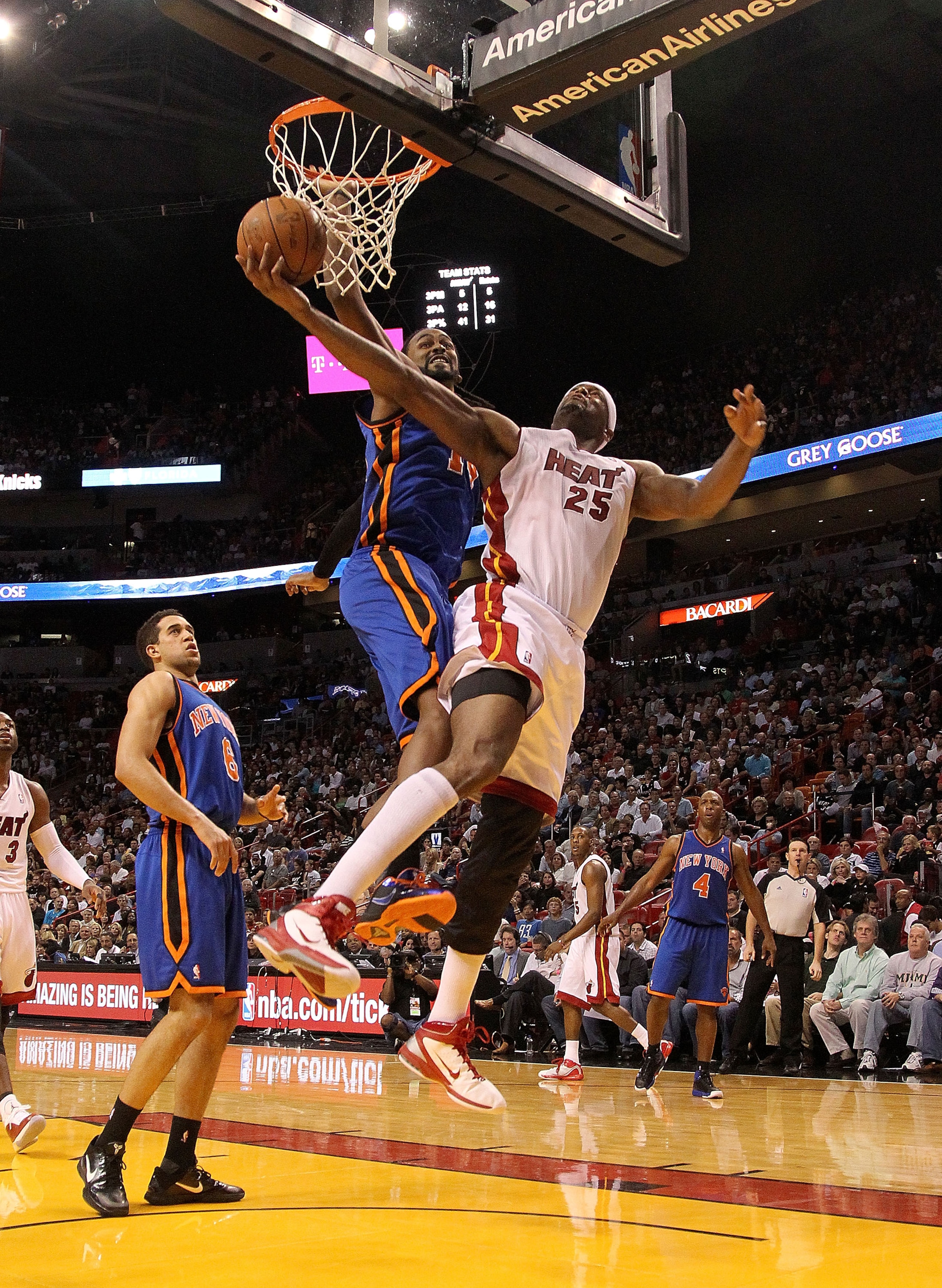 MIAMI, FL - FEBRUARY 27: Eric Dampier #25 of the Miami Heat takes a shot against Ronny Turiaf #14 of the New York Knicks during a game at American Airlines Arena on February 27, 2011 in Miami, Florida. NOTE TO USER: User expressly acknowledges and agrees
