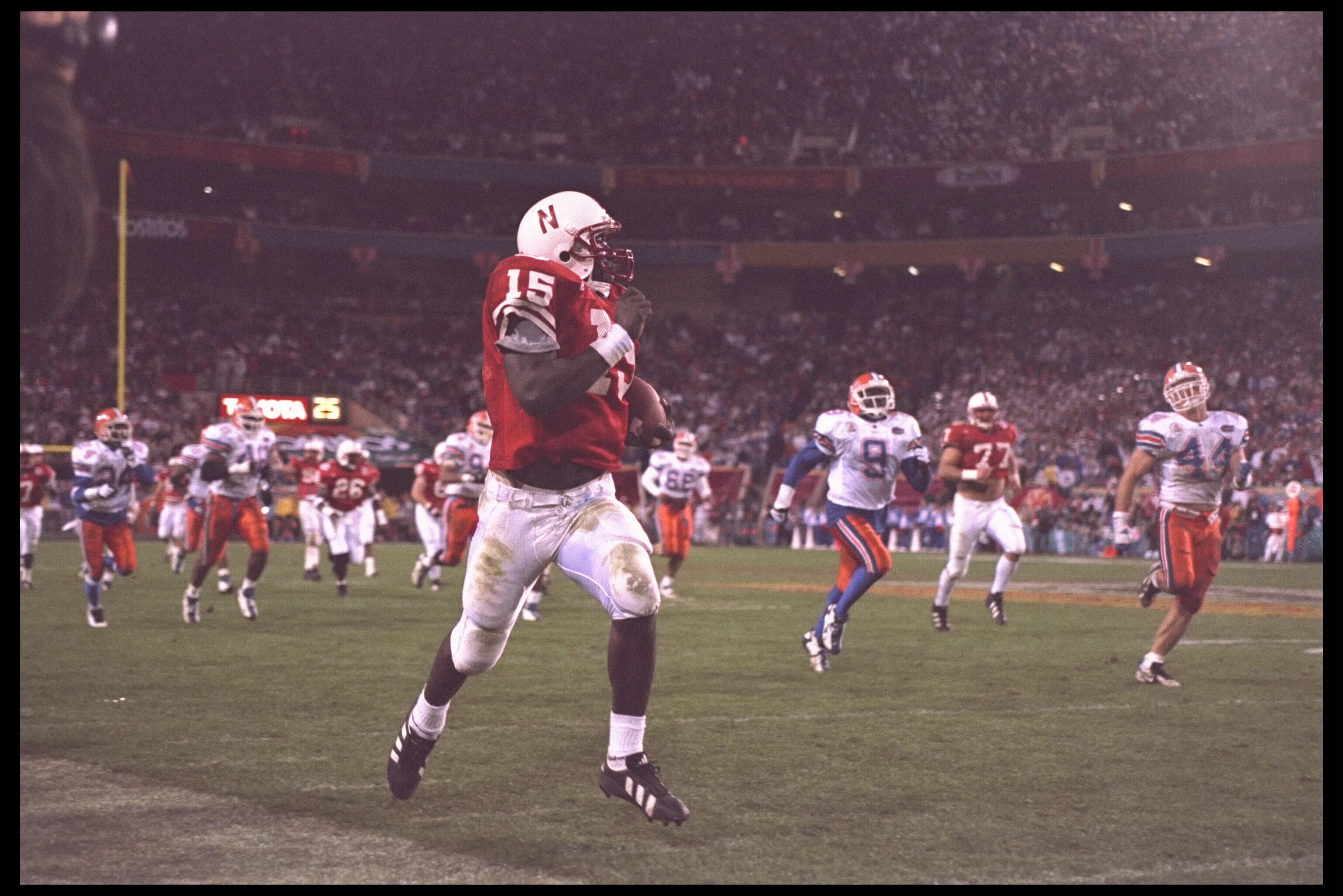 2 Jan 1996: Quarterback Tommie Frazier #15 of the Florida Gators takes his quarterback keeper to the endzone for a score against the Nebraska Cornhuskers in the Fiesta Bowl at Sun Devil Stadium in Tempe, Arizona. Nebraska defeated Florida 62-24. Mand 2 Jan 1996: Quarterback Tommie Frazier #15 of the Florida Gators takes his quarterback keeper to the endzone for a score against the Nebraska Cornhuskers in the Fiesta Bowl at Sun Devil Stadium in Tempe, Arizona. Nebraska defeated Florida 62-24. Mand